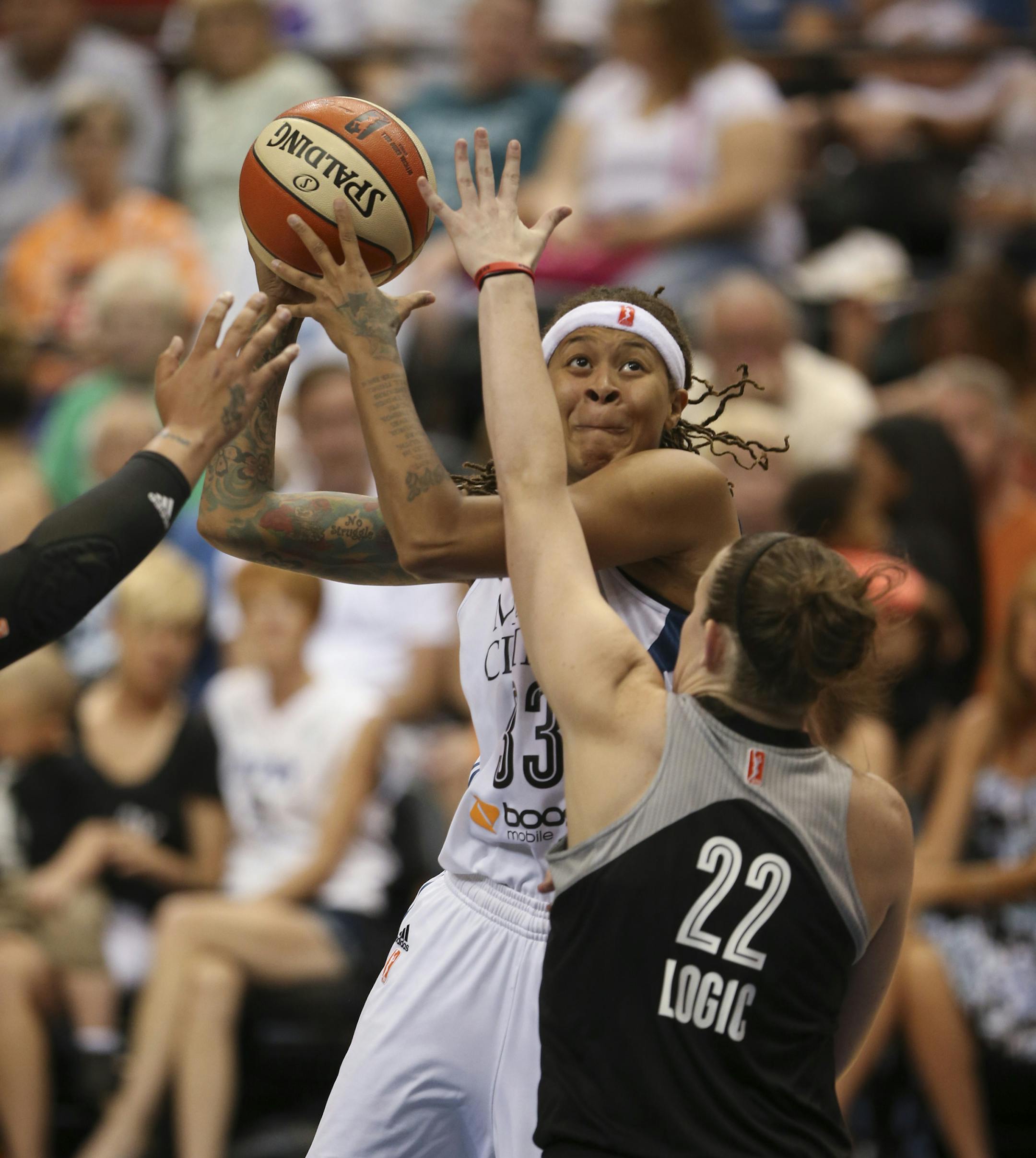 The Lynx' Seimone Augustus looked for a shot over the defense of the Stars' Samantha Logic in the third quarter Sunday night at Target Center. ] JEFF WHEELER • jeff.wheeler@startribune.com The Minnesota Lynx beat the San Antonio Stars 66-49 in an WNBA game Sunday night, July 12, 2015 at Target Center in Minneapolis.