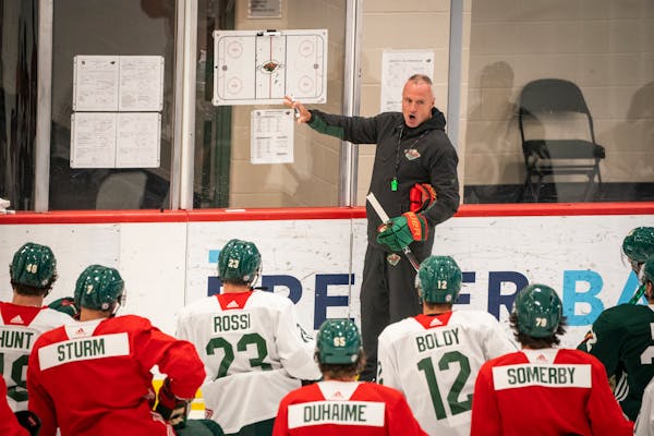 Coach Dean Evason instructed players during the first day of Wild camp Thursday at Tria Rink in St. Paul.