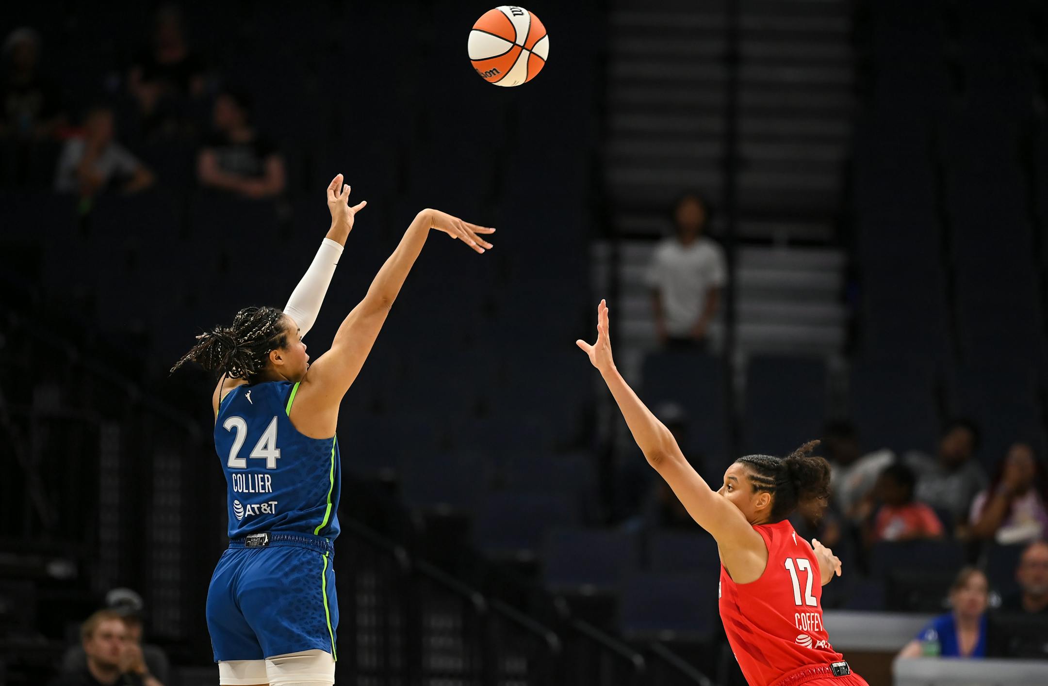 Minnesota Lynx forward Napheesa Collier hits a 3-pointer as she's defended by Atlanta Dream forward Nia Coffey in the second half.