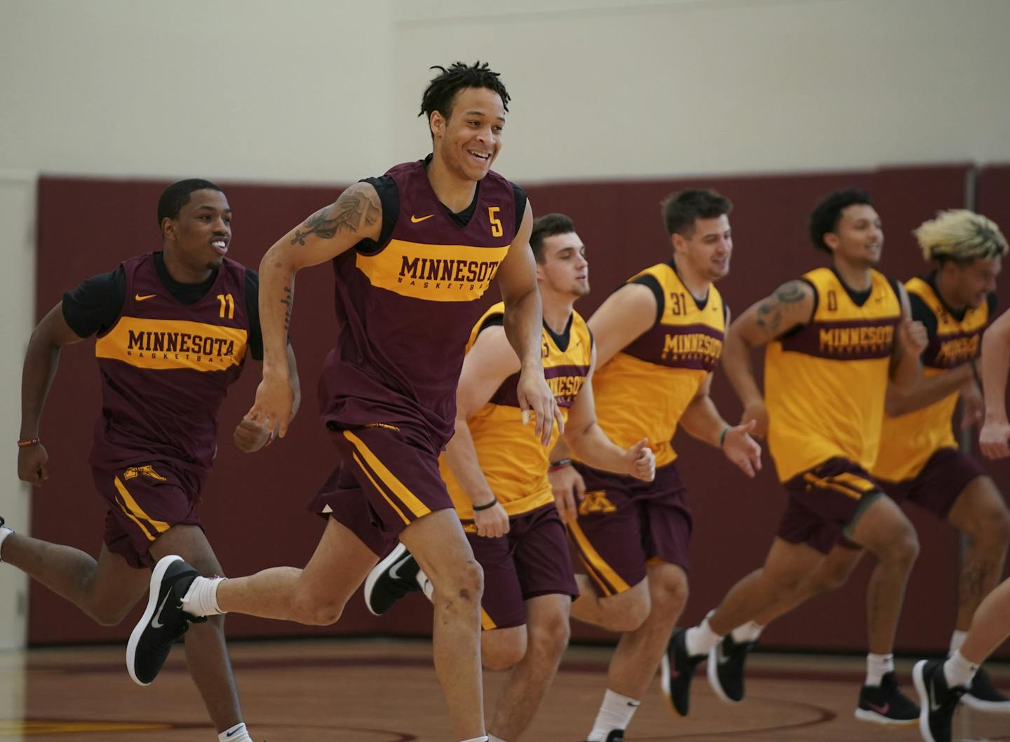 Junior guard Amir Coffey (5), shown running sprints with the rest of the team, is at full strength for the upcoming season. ] JEFF WHEELER &#xef; jeff.wheeler@startribune.com The University of Minnesota men's basketball team practiced Tuesday afternoon, September 25, 2018 at the new basketball facility.