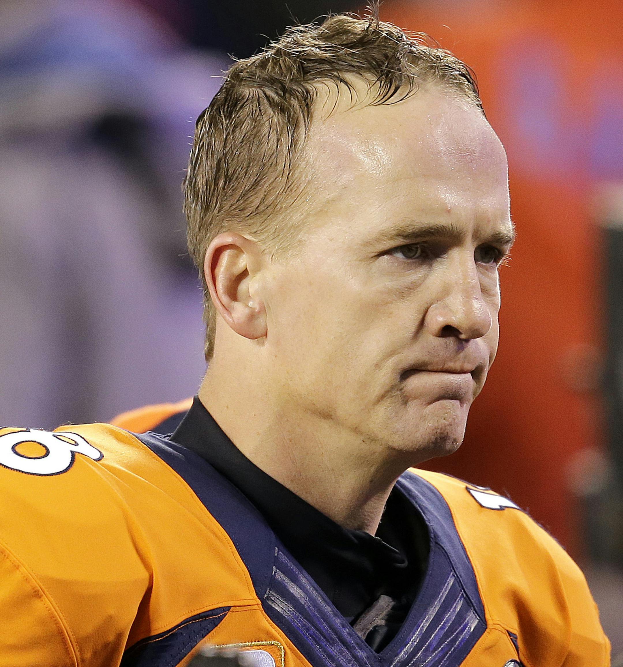 FILE - In this Feb. 2, 2014 file photo, Denver Broncos' Peyton Manning walks off the field after the NFL Super Bowl XLVIII football game against the Seattle Seahawks in East Rutherford, N.J. Manning delivers the keynote address at the Boy Scouts of America's annual breakfast Wednesday, April 16, 2014 in Denver, and makes his first public comments since the Denver Broncos were trounced by Seattle from the opening snap of the Super Bowl. (AP Photo/Chris O'Meara, File) ORG XMIT: NY155