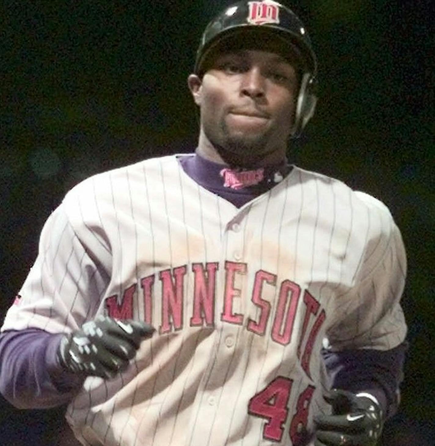 Minnesota Twins' Torii Hunter (48) is congratulated by Todd Walker (12) after his solo home run in the fifth inning off Detroit Tigers starter Brian Moehler Thursday, April 15, 1999, in Detroit. (AP Photo/Duane Burleson) ORG XMIT: MIN2015021116420251