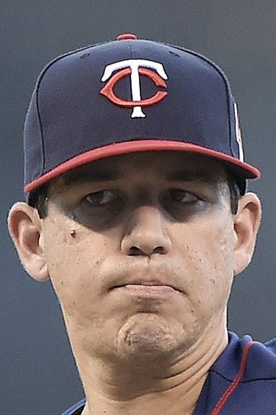 Minnesota Twins starting pitcher Tommy Milone throws against the Kansas City Royals on Wednesday, Aug. 28, 2014, at Kauffman Stadium in Kansas City, M