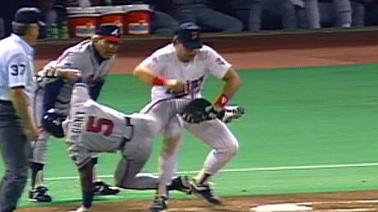 The classic image from the 1991 World Series is from Game 2, when Atlanta's Ron Gant had just singled to left field. But he was tagged coming back to first base by Kent Hrbek, who may have contributed to Gant's situation with a leg lift.