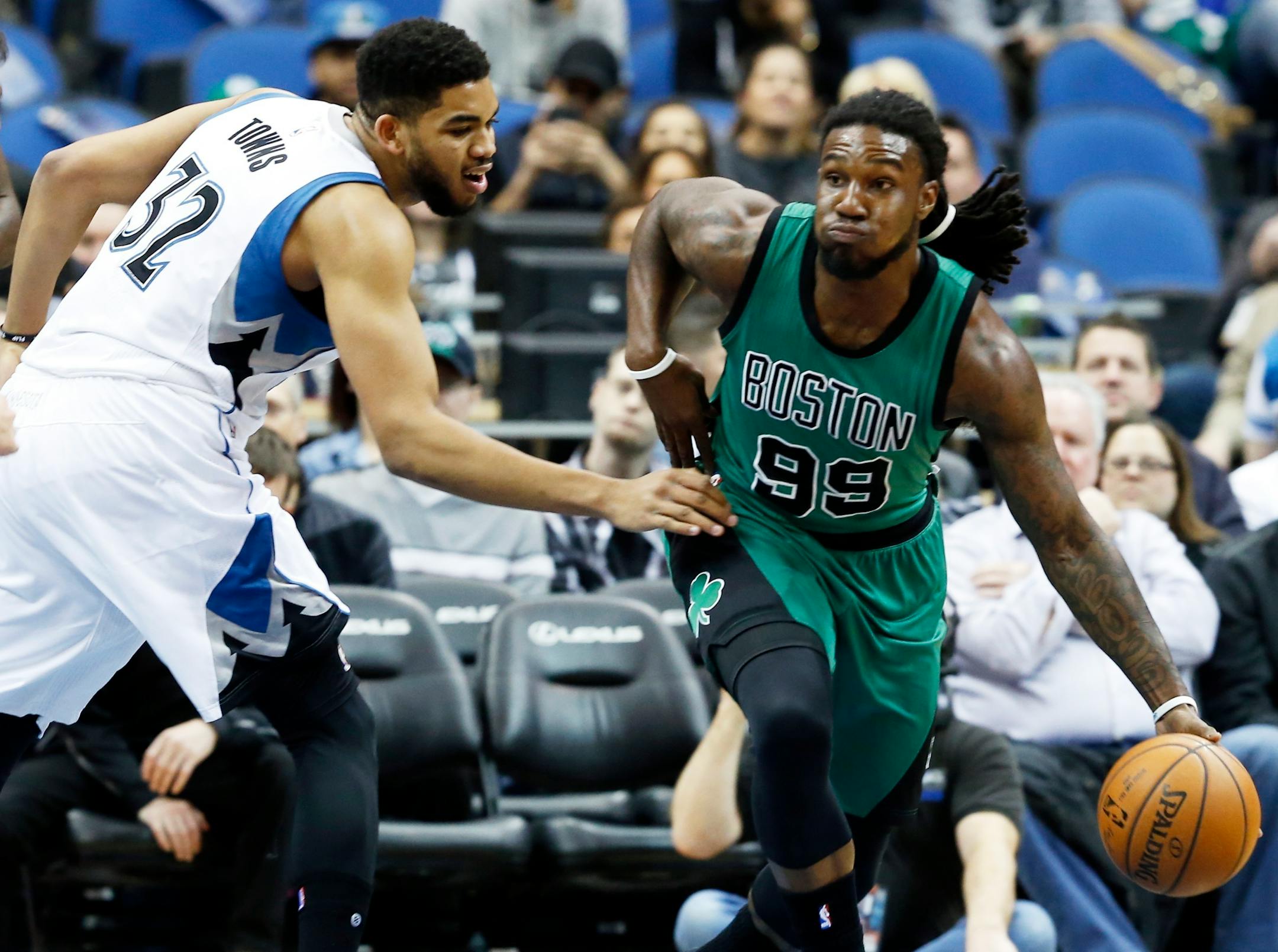The Celtics' Jae Crowder dribbled past Wolves center Karl-Anthony Towns during the first quarter Monday.