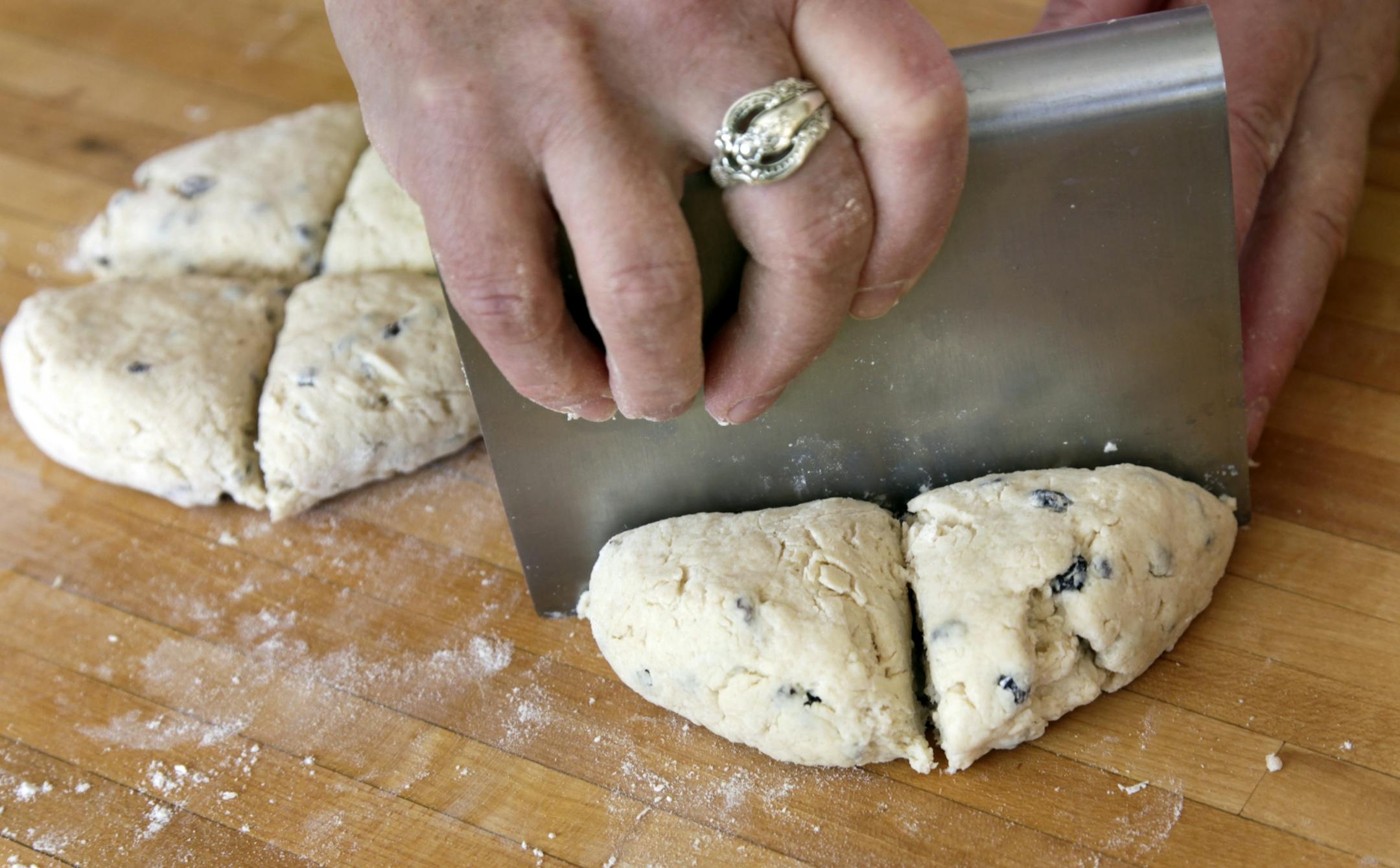 Disks of dough are cut into four wedges.