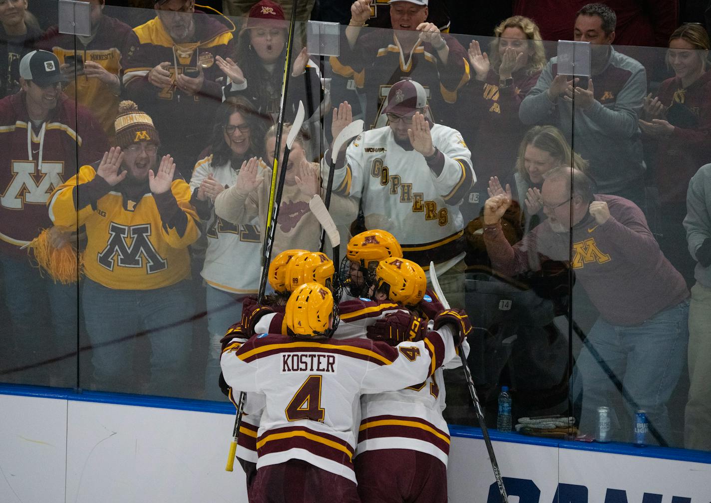 Minnesota Gophers forward Logan Cooley (92) was congratulated on his go ahead goal in the second period. The University of Minnesota Gophers faced the St. Cloud State Huskies in an NCAA Division I Men's Ice Hockey Championship second round game Saturday night, March 25, 2023 at Scheels Arena in Fargo, North Dakota. ] JEFF WHEELER • jeff.wheeler@startribune.com