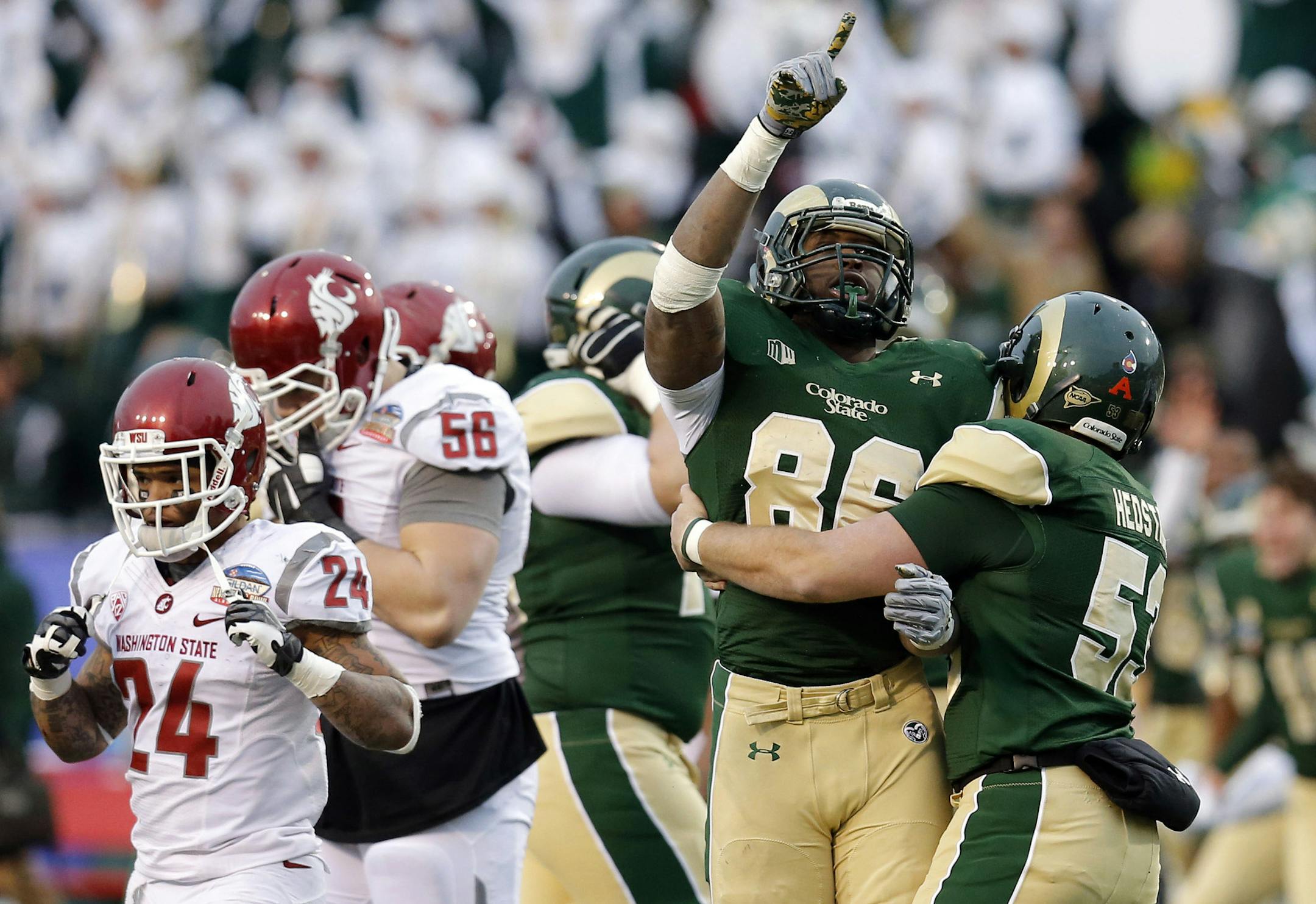 Colorado State players celebrate their victory over Washington State in the 2014 New Mexico Bowl.