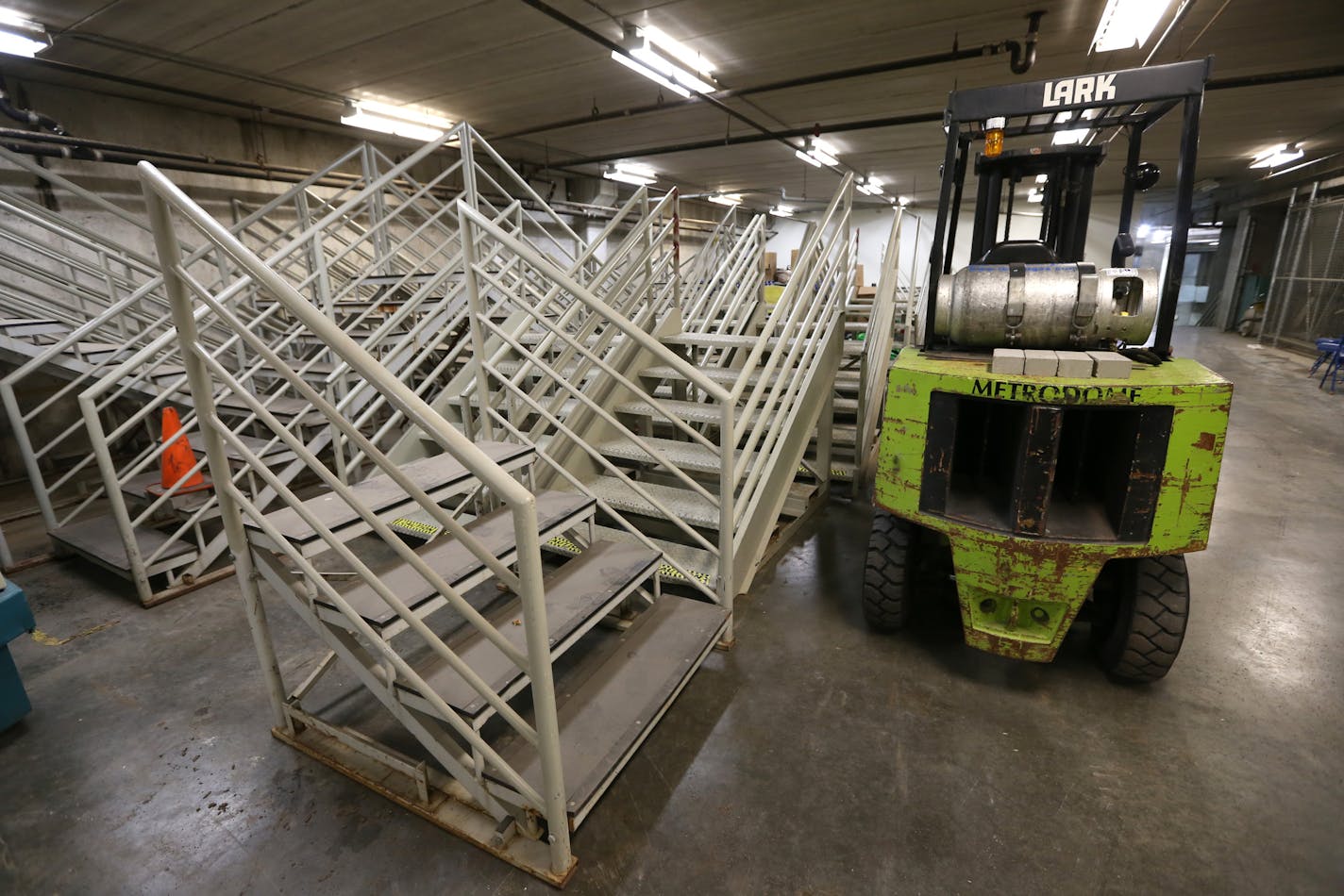 Spare stairs and fork-lifts are stored in the lower garages of the Metrodome, photographed on 7/19/13. In the market for a 10-year-old batting cage with more than a few scuff marks on it? Or how about a row of five or six bleachers seats? Or a top-of-the-line, NCAA basketball hoop and backboard? With the Hubert H. Humprhey Metrodome just six months away from the wrecking ball, the stadium operator is working to come up with a plan to sell off the Dome's assets. The sale of items, ranging from sp