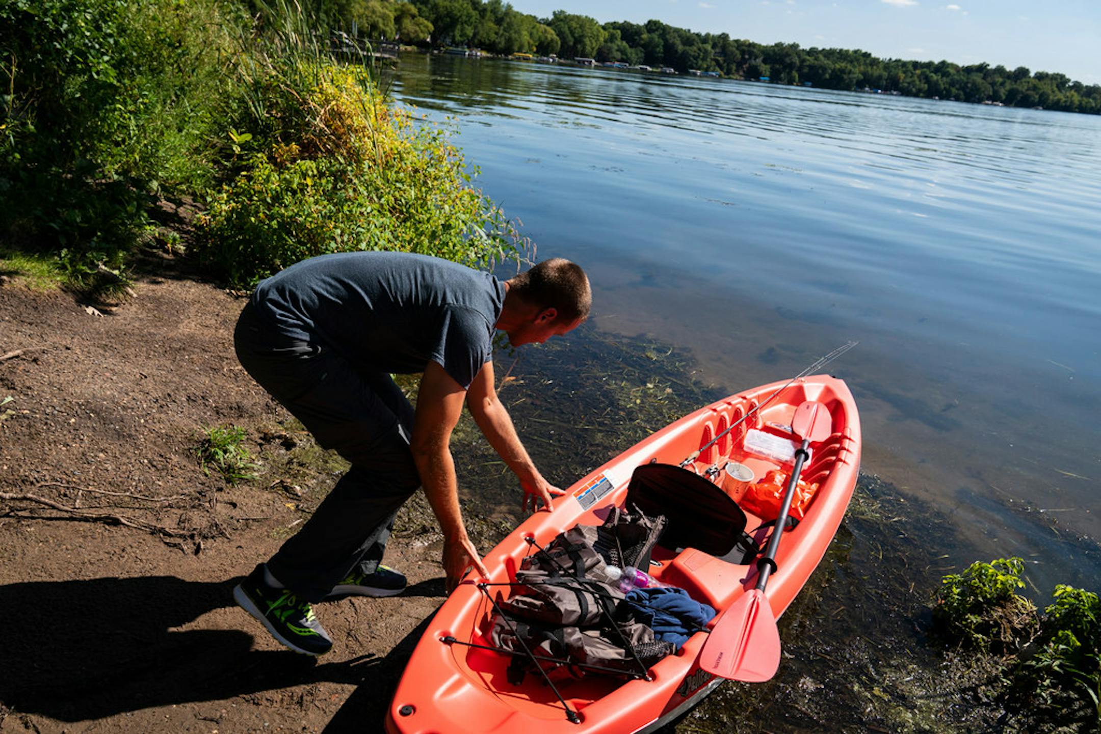 Dennis Shaw, visiting the Twin Cities for work from Indiana, pulled a kayak into Bald Eagle Lake in White Bear Township. for afternoon fishing last week.