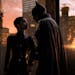 This image released by Warner Bros. Pictures shows Zoe Kravitz, left, and Robert Pattinson in a scene from "The Batman." (Jonathan Olley/Warner Bros. 