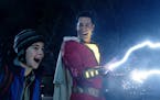 Freddy Freeman (Jack Dylan Grazer) watches Shazam (Zachary Levi) do his "Lightning from my hands" routine, which will have you humming "Eye of the Tig