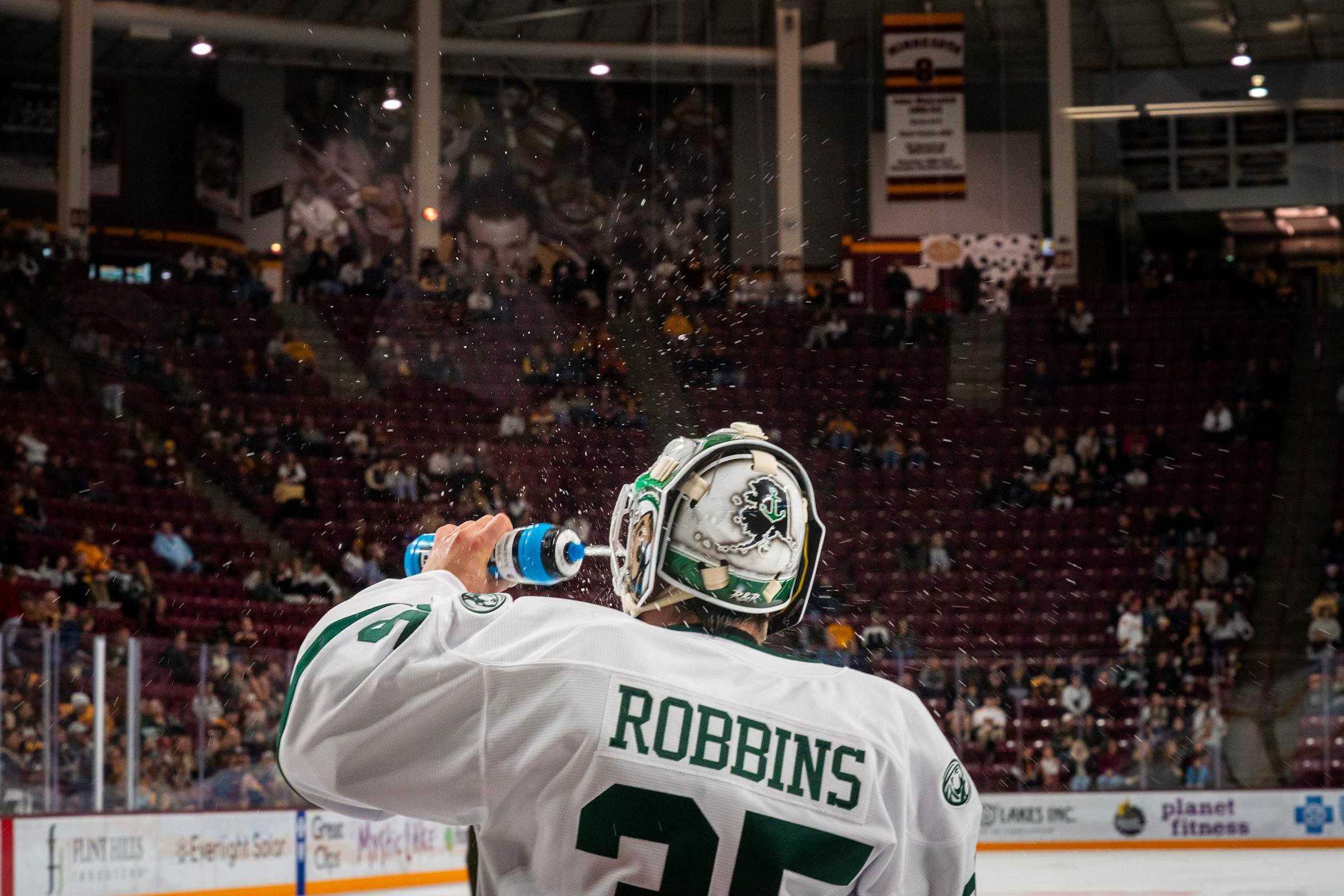 Bemidji State's goalkeeper Raythan Robbins sprays himself with water during a time-out at the exhibition game against the University of Minnesota.