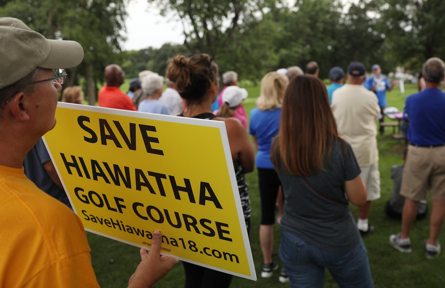 Golfers and supporters of the Hiawatha Golf Course held signs as they rallied against the Park Board's recent decision to reduce pumping and close the course at the end of 2019 season Tuesday. ] ANTHONY SOUFFLE &#xef; anthony.souffle@startribune.com Golfers and supporters of the Hiawatha Golf Course rallied against the Park Board's recent decision to reduce pumping and close the course at the end of 2019 season Tuesday, Aug. 15, 2017 in south Minneapolis.