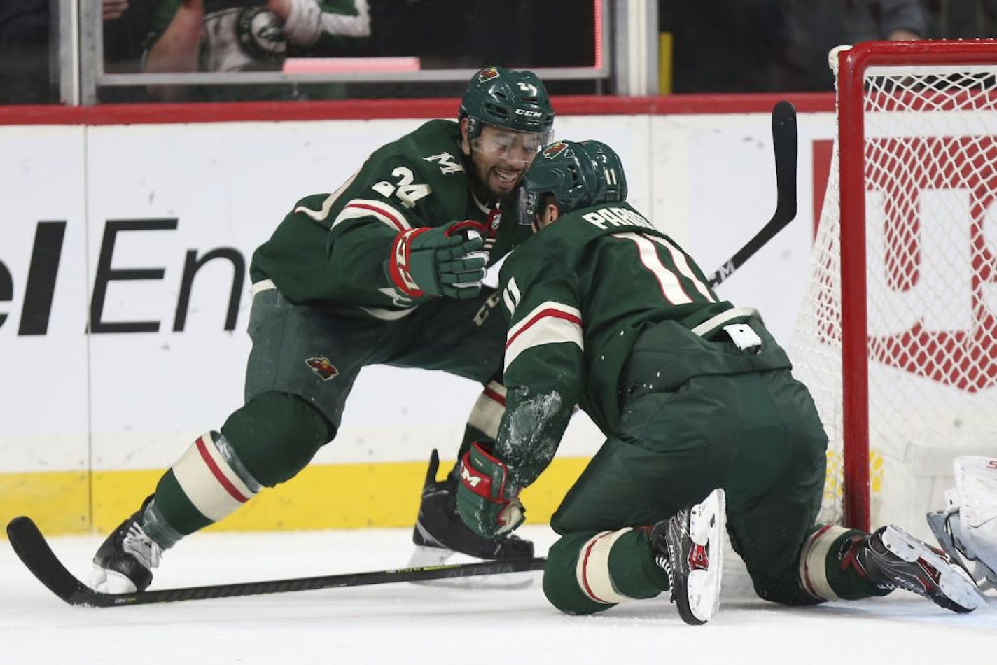 Minnesota Wild's Matt Dumba (24) celebrates teammate Zach Parise's (11) goal in the second period of an NHL hockey game against the Carolina Hurricanes, Saturday, Nov. 16, 2019, in St. Paul, Minn.