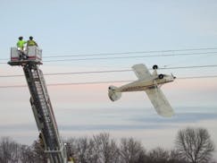 The pilot of this plane was able to walk away without any injuries after crashing into power lines in Louisville Township, Scott County Sheriff Luke H