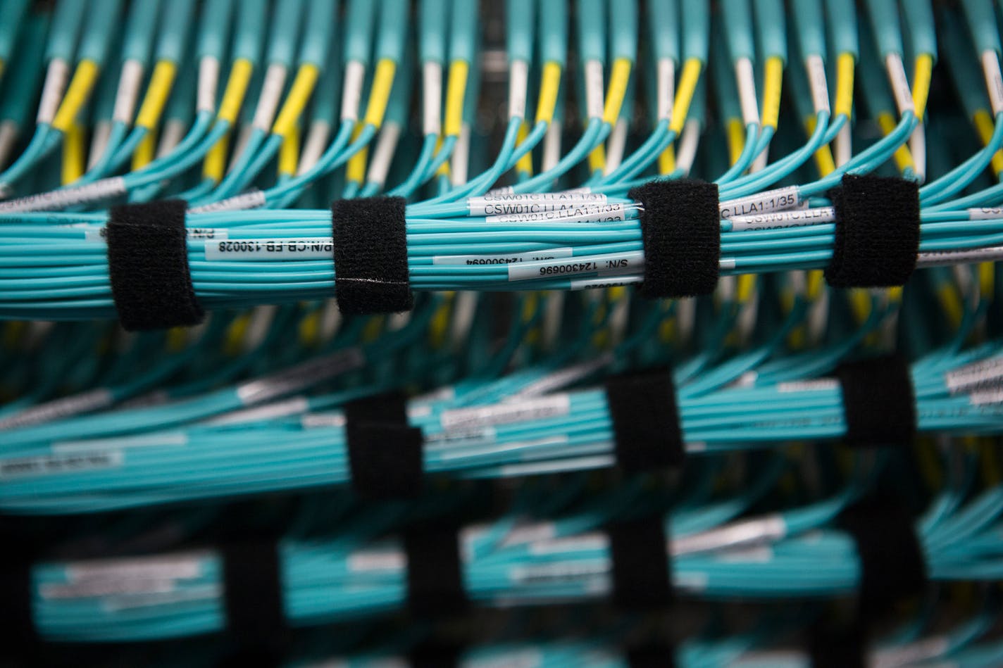 Bundles of electrical wiring are seen in the server hall at Facebook Inc.'s new data storage center near the Arctic Circle in Lulea, Sweden, on Wednesday, June 12, 2013. The data center is Facebook's first outside the U.S., poised to handle all data processing from Europe, Middle East and Africa and the server hub is largest of its kind in Europe, and most northerly of its magnitude anywhere on earth. Photographer: Simon Dawson/Bloomberg