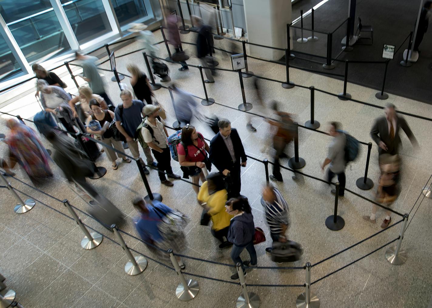 Travelers stood in line at the north security checkpoint at Minneapolis-St. Paul International Airport. Automatic screening lanes are currently being installed at the south checkpoint. The south checkpoint will be closed to general travelers for the next 3-weeks. ] CARLOS GONZALEZ &#xef; cgonzalez@startribune.com - August 22, 2017, Bloomington, MN, MSP Airport Terminal 1, Passengers flying out of Minneapolis-St. Paul International Airport may need extra time to pass through security as all the g