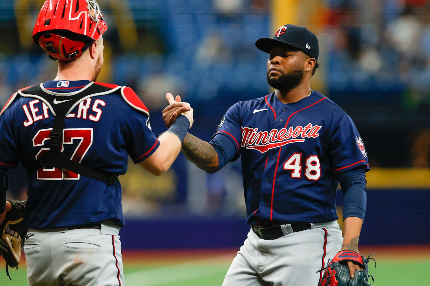 Minnesota Twins relief pitcher Alex Colome (48) celebrates with catcher Ryan Jeffers after defeating the Tampa Bay Rays in a baseball game on Sunday, Sept. 5, 2021, in St. Petersburg, Fla. (AP Photo/Scott Audette)