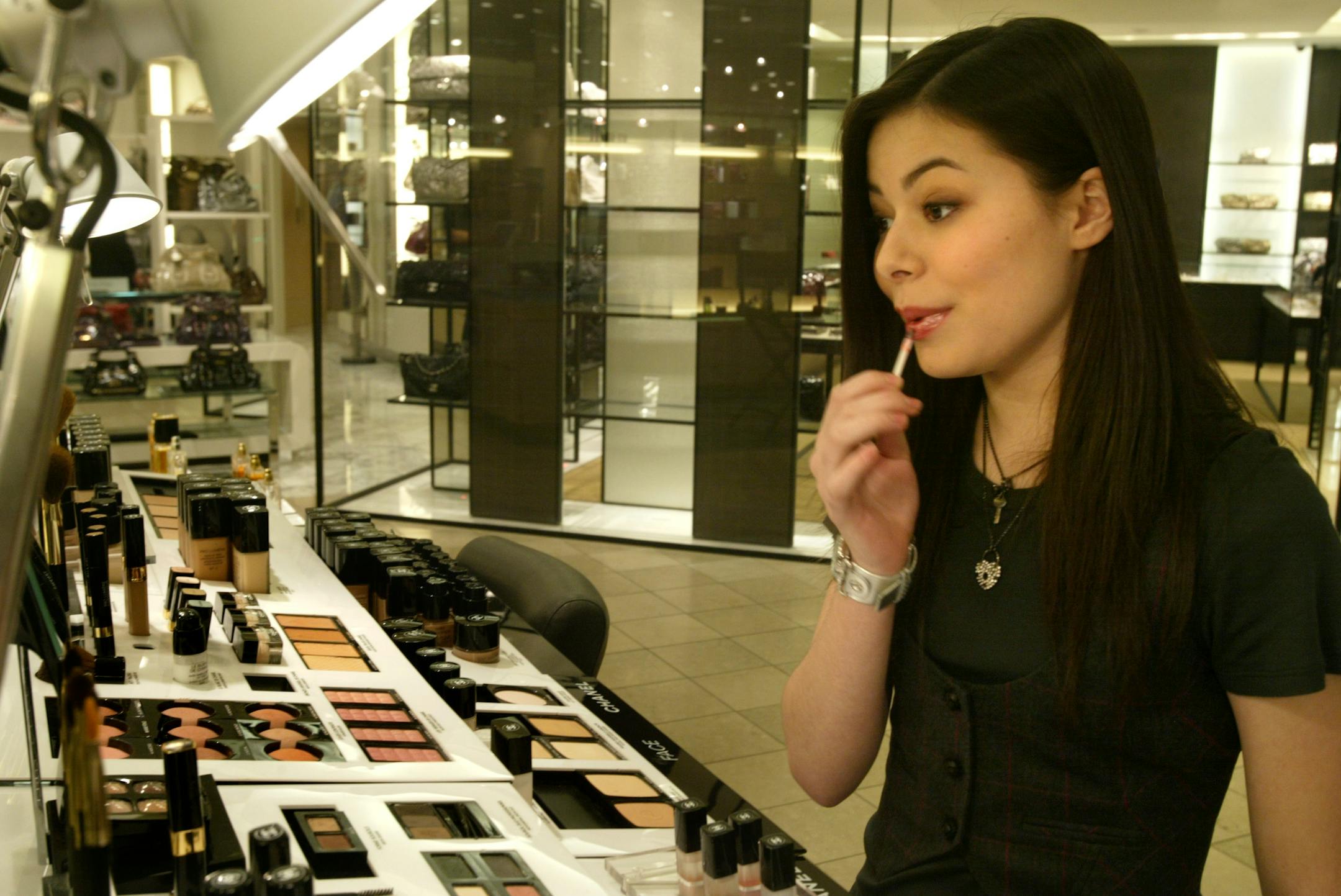 Miranda Cosgrove, teenage star of Nickelodeon's series "iCarly," purchased some lipstick after she tried on the color at Nordstroms before her autograph-signing event.