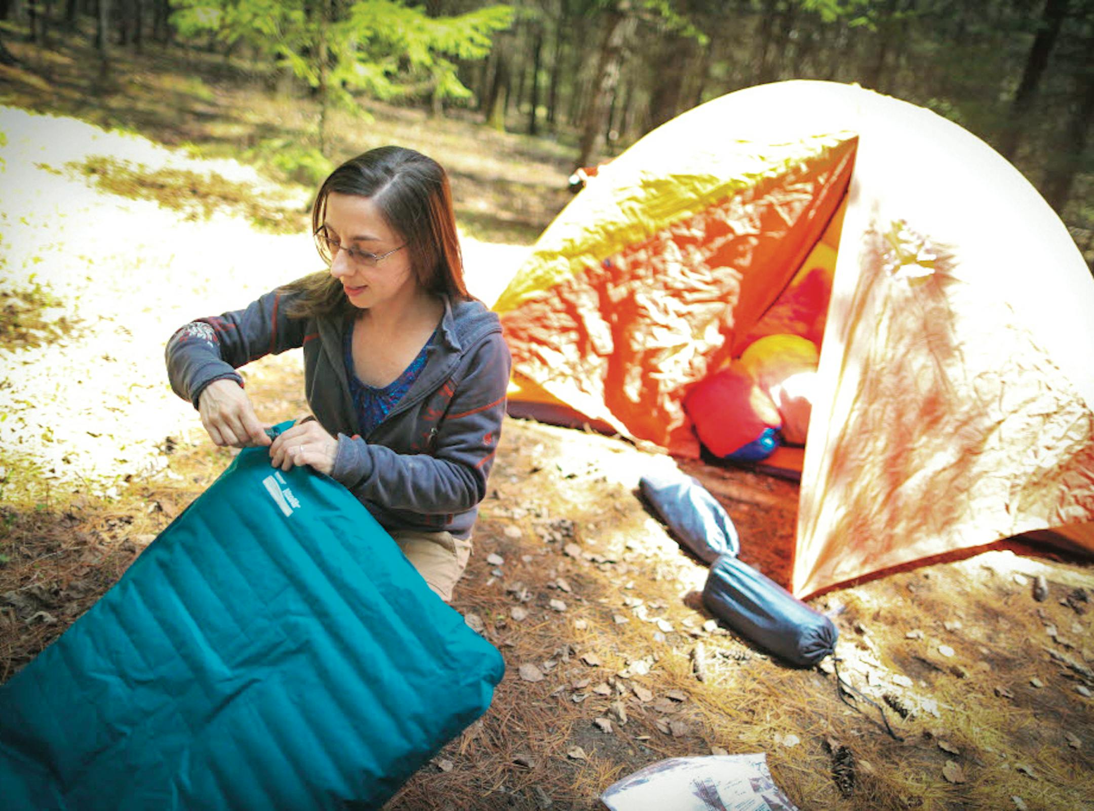 For campers like Suzanne Jost of Eden Prairie, who set up the tent for a family camping trip at Jay Cooke State Park in 2013, an online reservation system will make trips more relaxing.