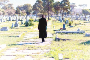 Young woman in a graveyard.