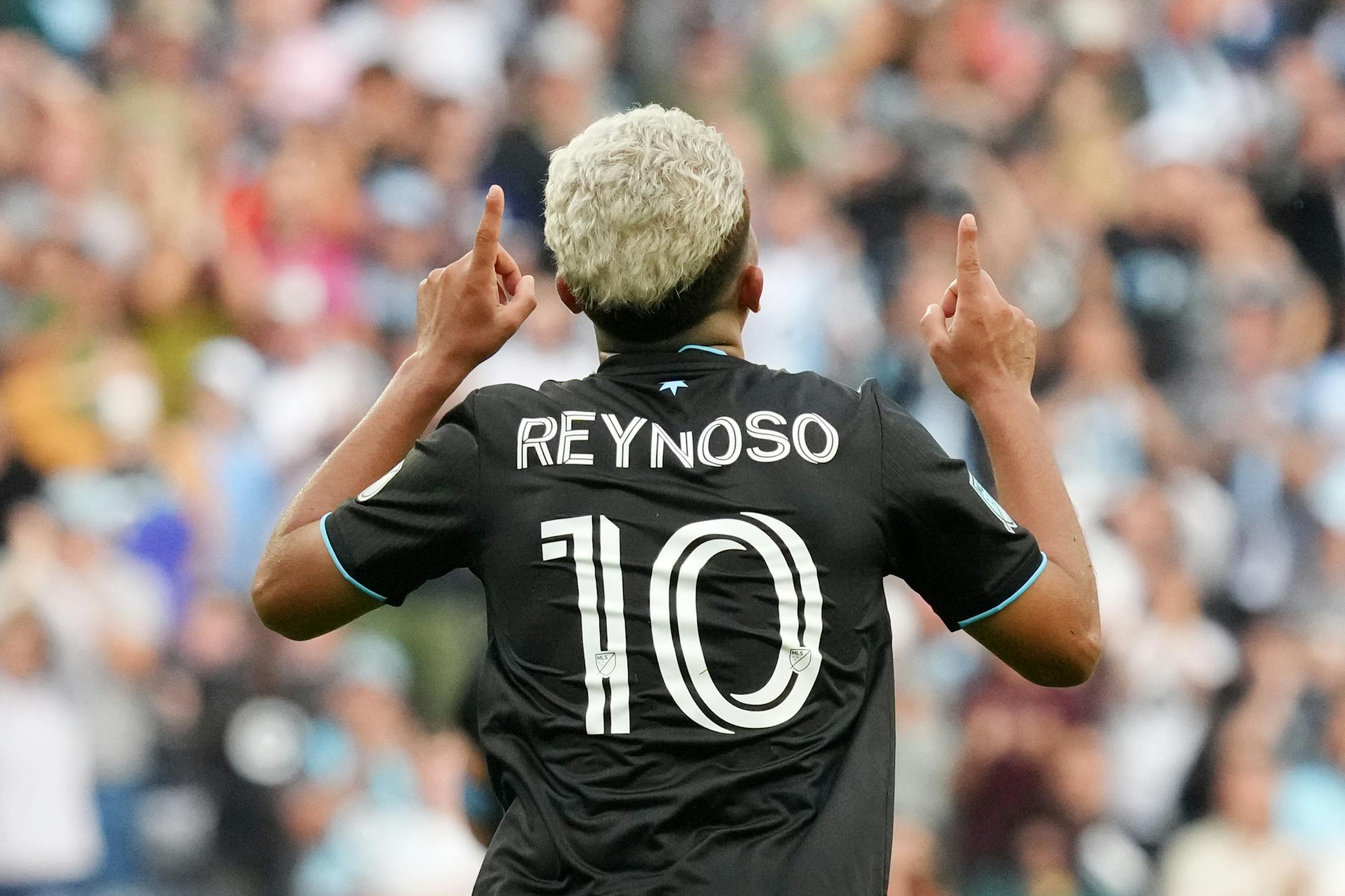 Minnesota United midfielder Emanuel Reynoso (10) celebrates after his free kick was deflected by a Houston player for a second-half own-goal during an MLS game between Minnesota United and the Houston Dynamo.