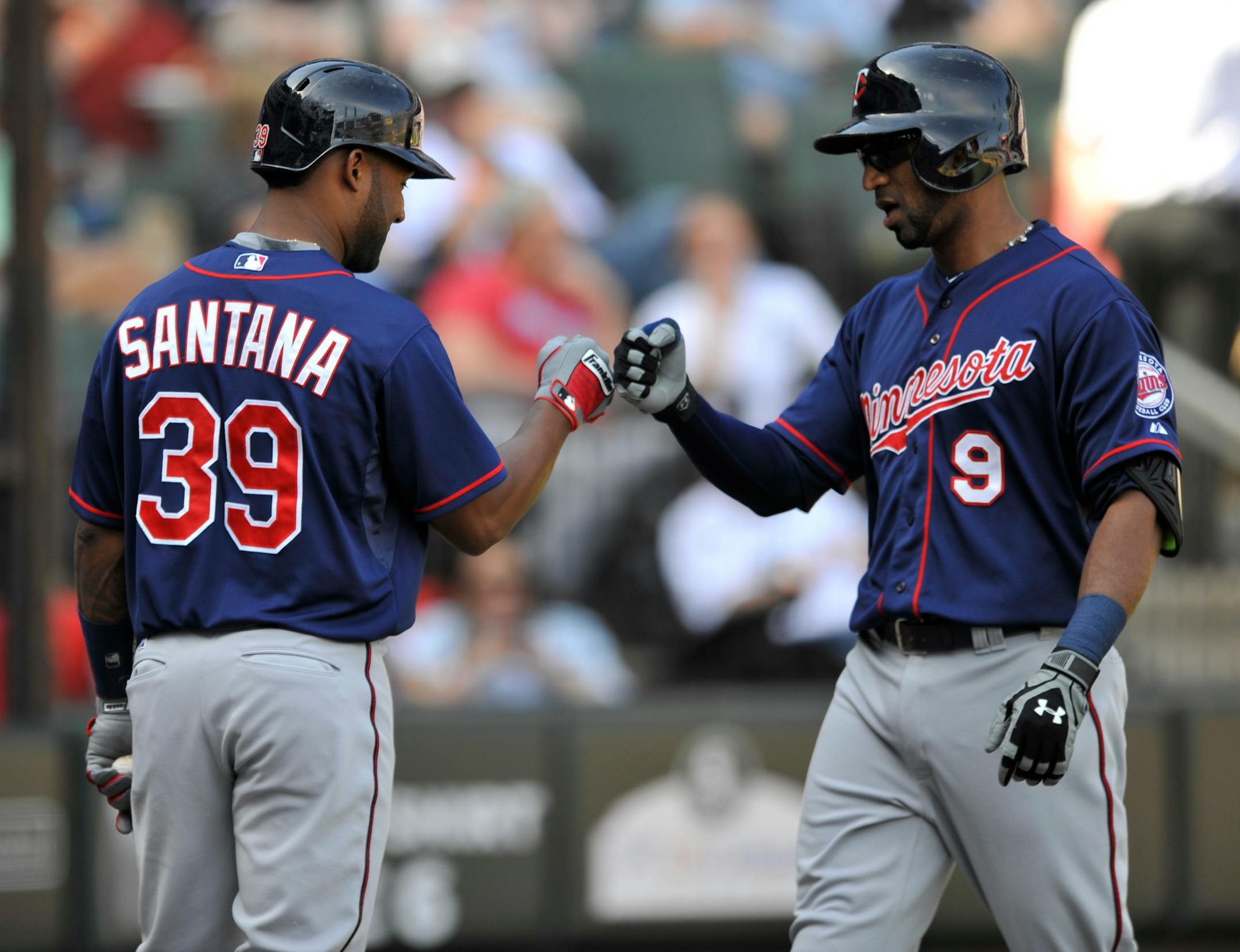 Minnesota Twins' Eduardo Nunez (9) and Danny Santana (39)