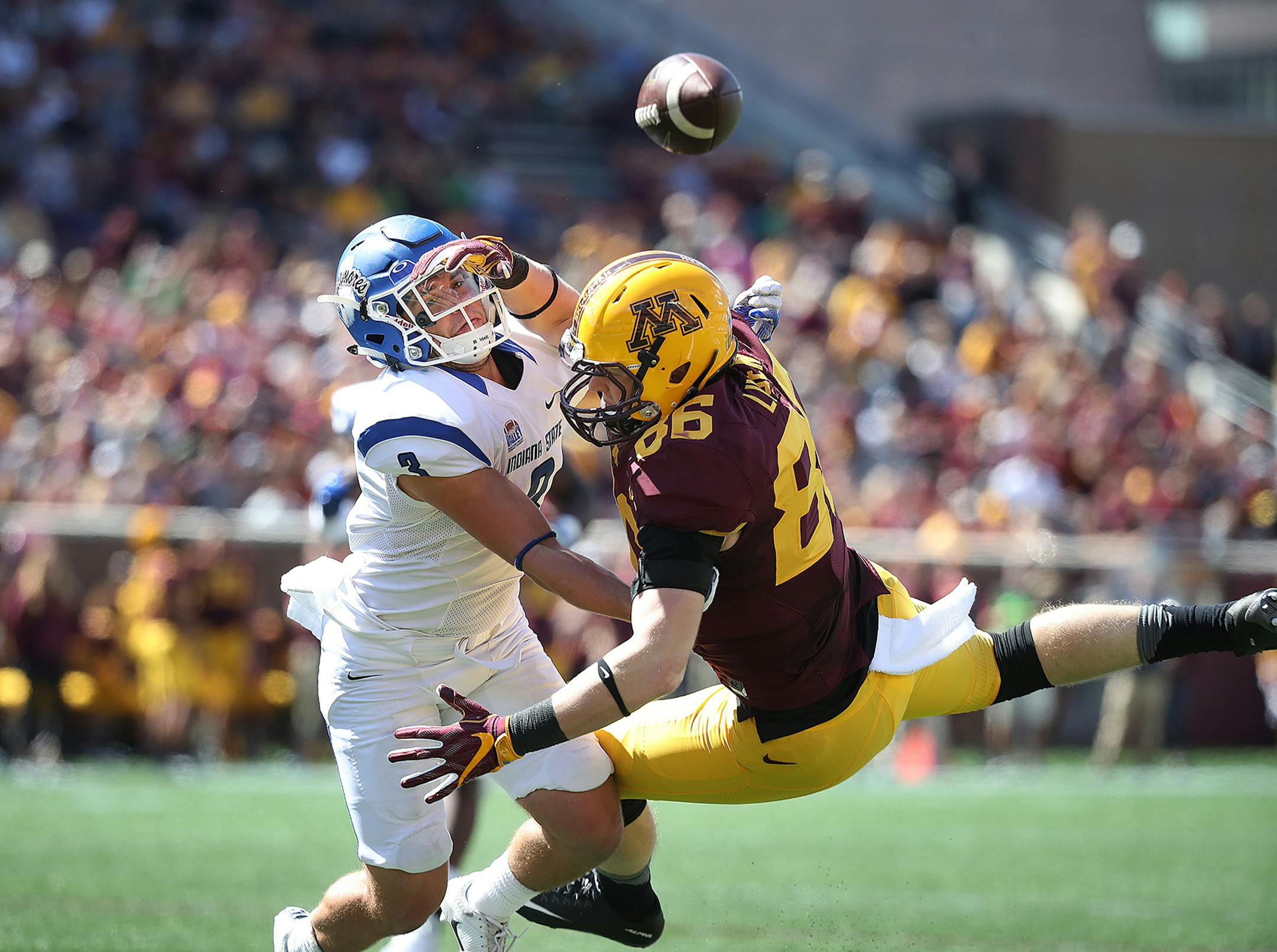 Minnesota tight end Brandon Lingen, right, is unable to come up with a pass short of the end zone while defended by Indiana State defensive back Tsali Lough