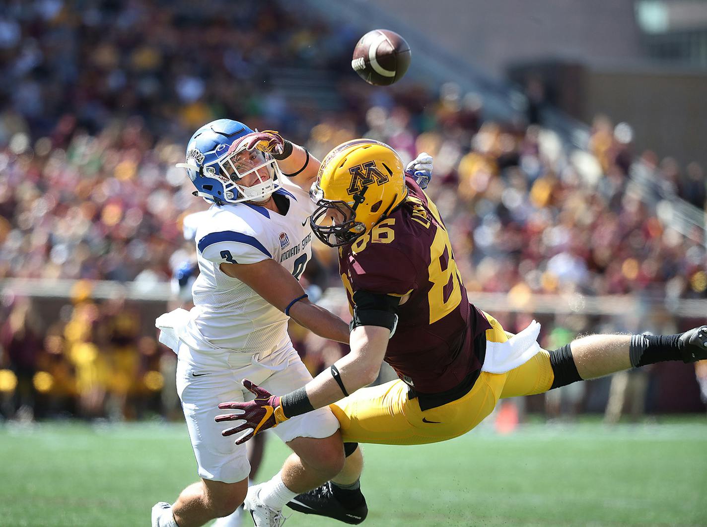 Minnesota tight end Brandon Lingen, right, is unable to come up with a pass short of the end zone while defended by Indiana State defensive back Tsali Lough