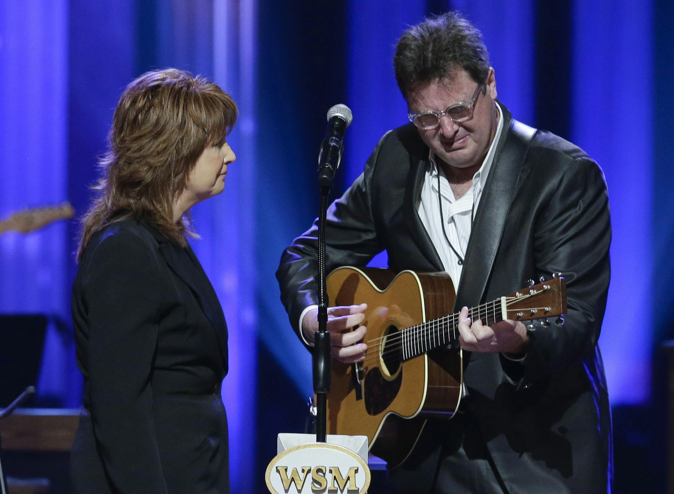 Vince Gill cries as he performs with Patty Loveless during the funeral for country music star George Jones in the Grand Ole Opry House on Thursday, May 2, 2013, in Nashville, Tenn. Jones, one of country music's biggest stars who had No. 1 hits in four separate decades, died April 26. (AP Photo/Mark Humphrey, Pool)
