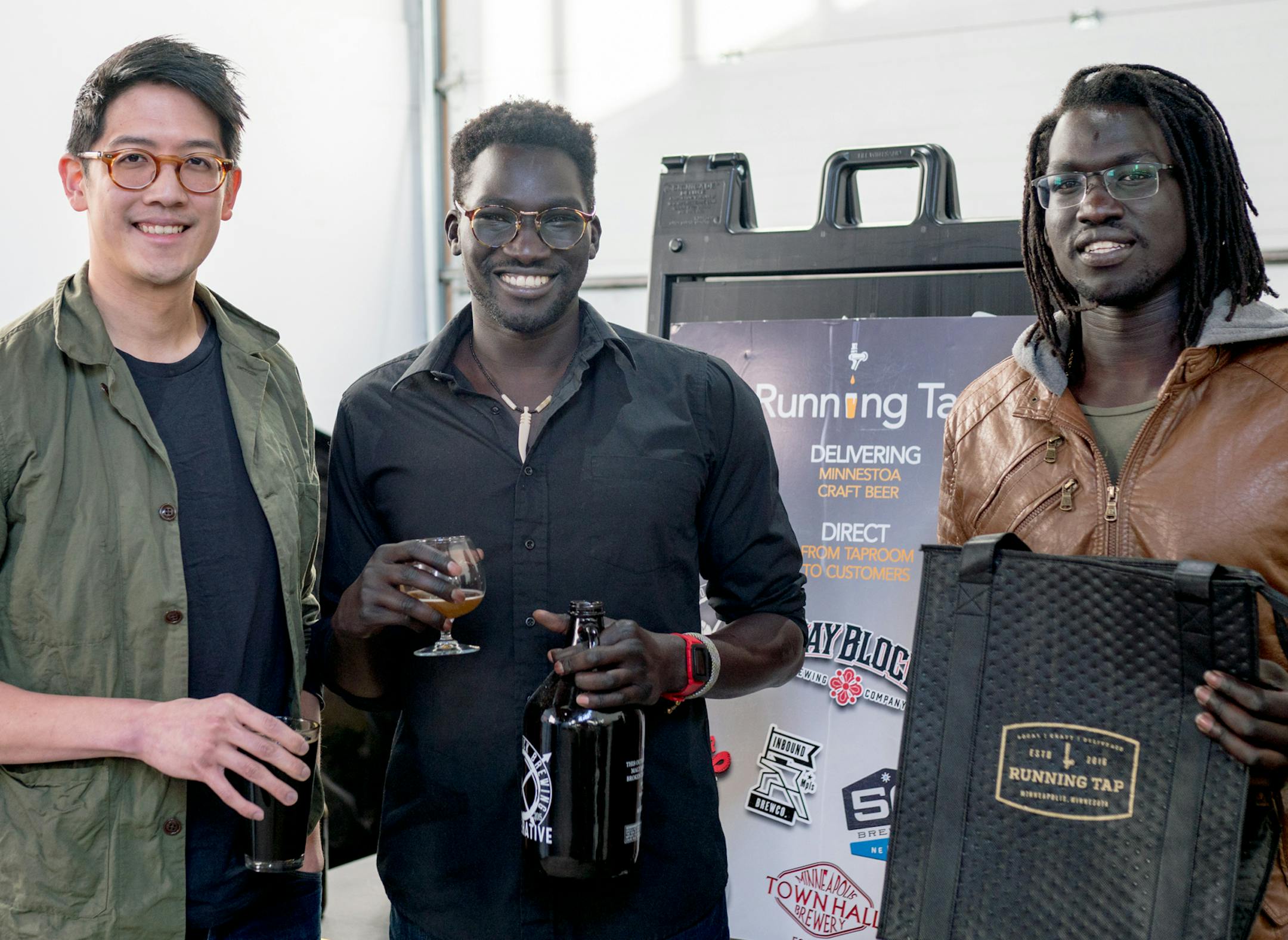 Chris Ho, CEO Isaac Tut and Moses Tut of Running-Tap, a north Minneapolis company of eight full-and-part time workers who deliver beer to consumers for a growing list of 20-plus Twin Cities microbreweries. Photo: Taylor Finger, Running-Tap.com