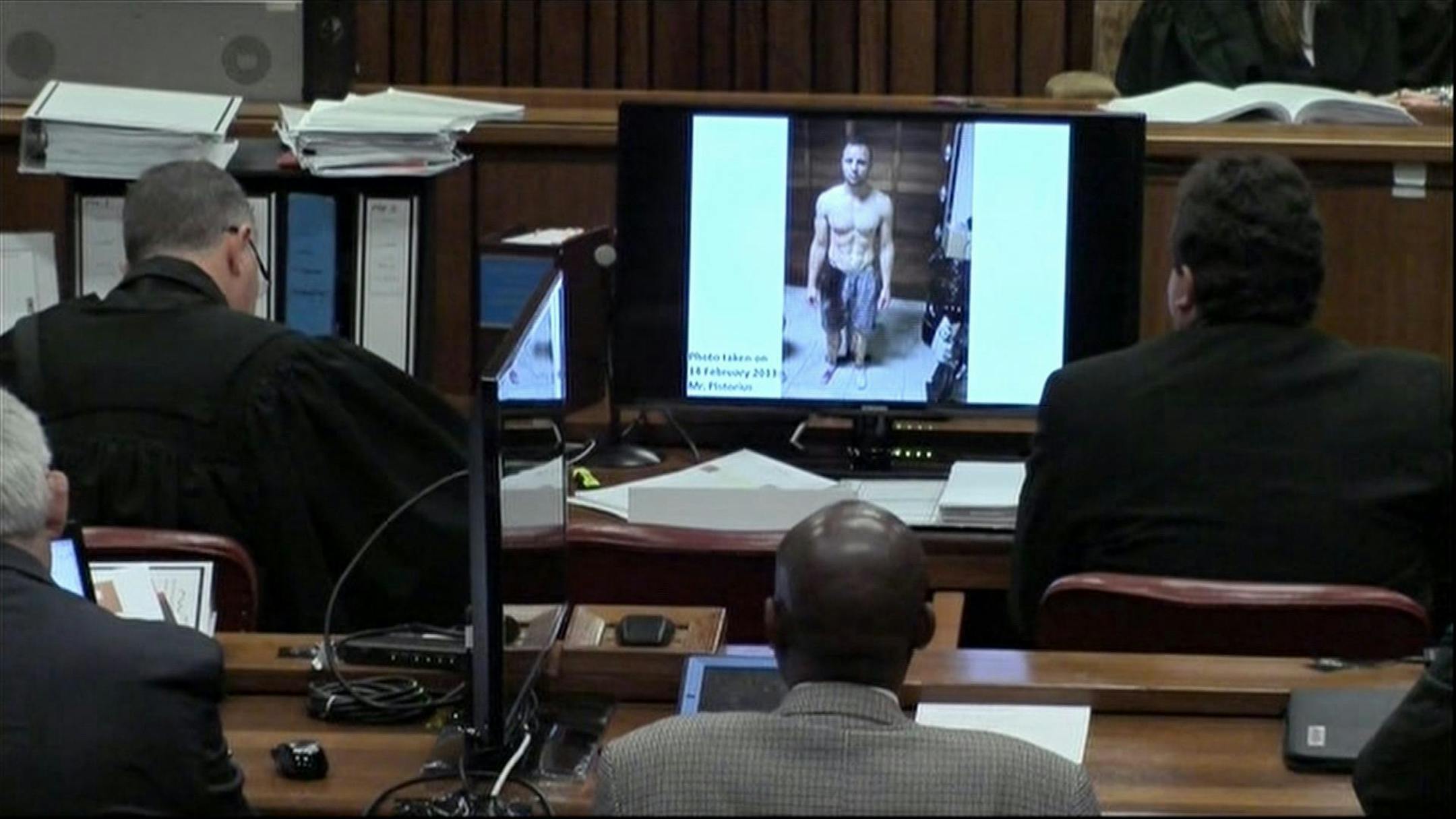 An image taken from the court pool TV via AP showing a police photograph of Oscar Pistorius with blood on his shorts and parts of his body.