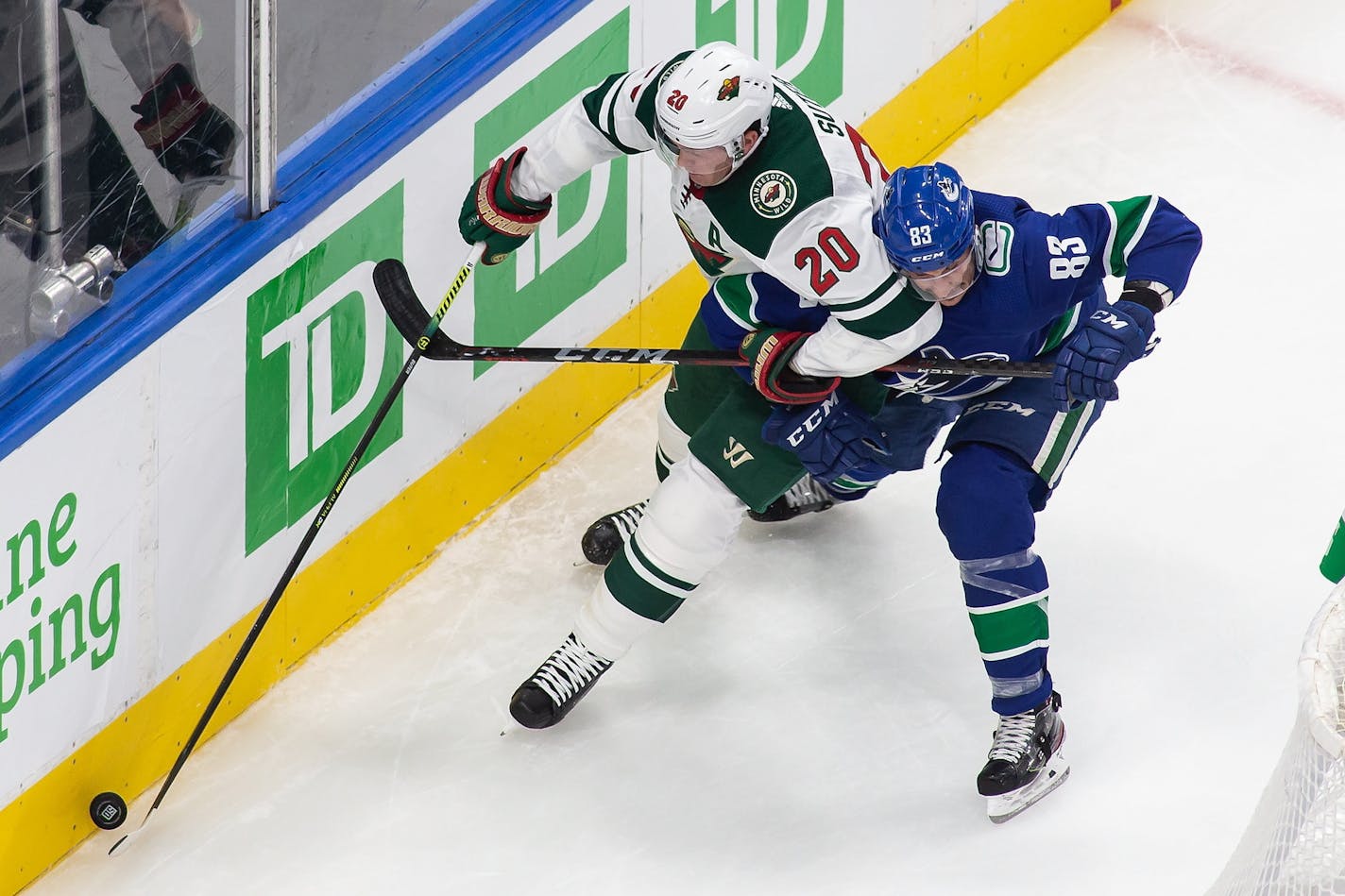 Wild defenseman Ryan Suter (20) battled Vancouver's Jay Beagle as the teams met in an NHL postseason game in Edmonton on Aug. 2. The Wild's season ended in Canada when it lost the best-of-five series to the Canucks.