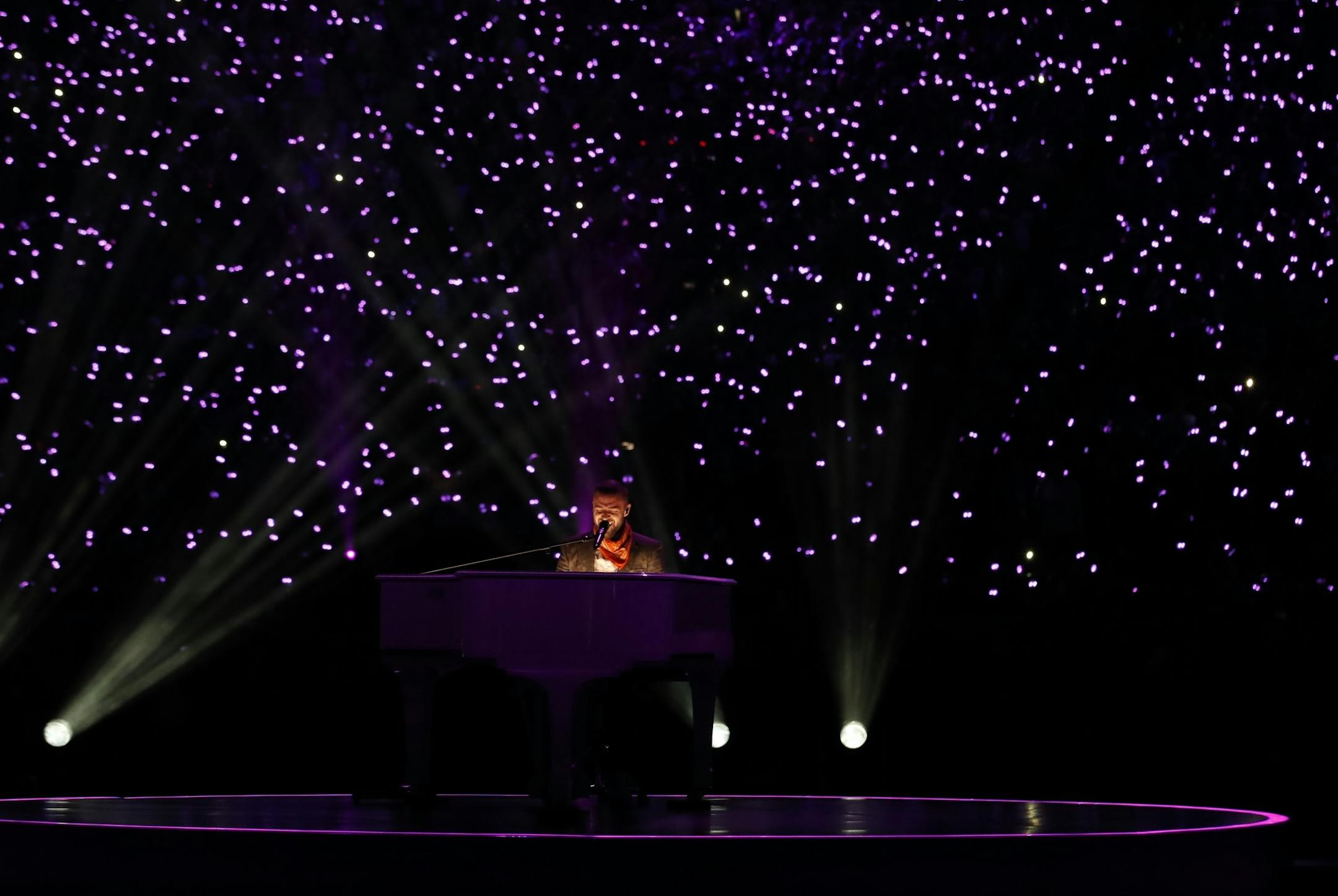 With a background of lights in the stands at U.S. Bank Stadium, Justin Timberlake played the piano and sang during the halftime show at Super Bowl LII.