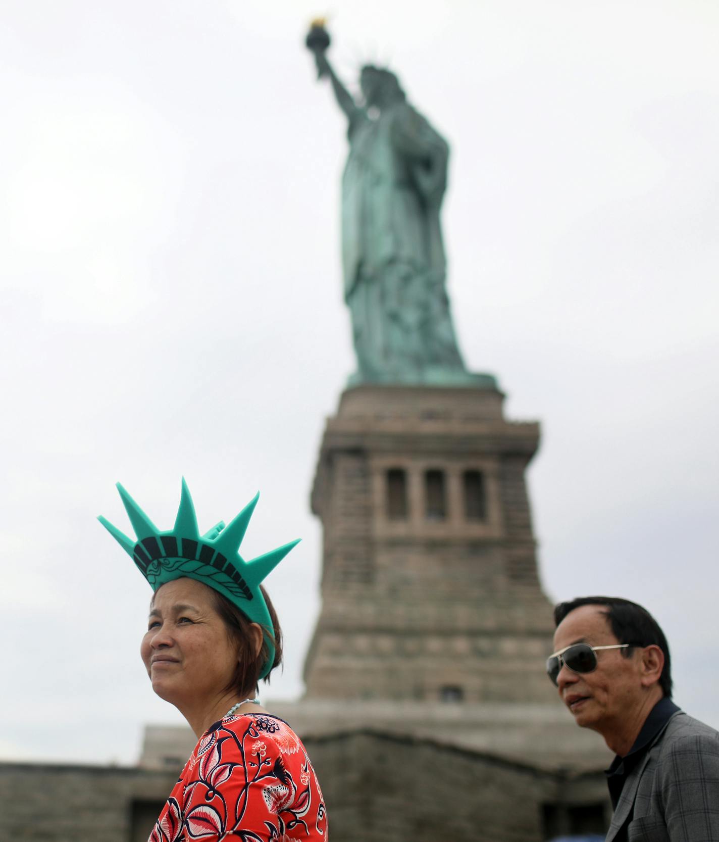 The Statue of Liberty looms over visitors to Ellis Island. This place may be iconic of the immigrant experience in New York City, but other places offer other vibrant -- and living -- looks at immigrants in New York. DAVID JOLES &#xef; david.joles@startribune.com