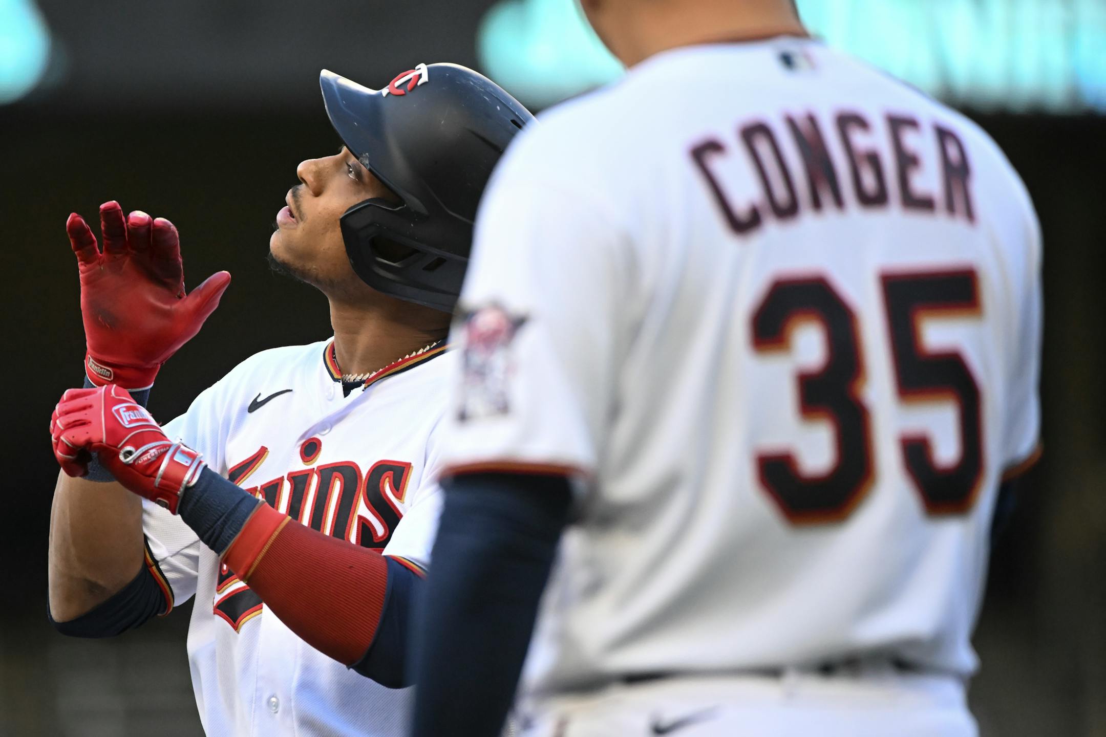 Minnesota Twins second baseman Jorge Polanco (11) reacts after reaching first base on a single in the bottom of the first inning.