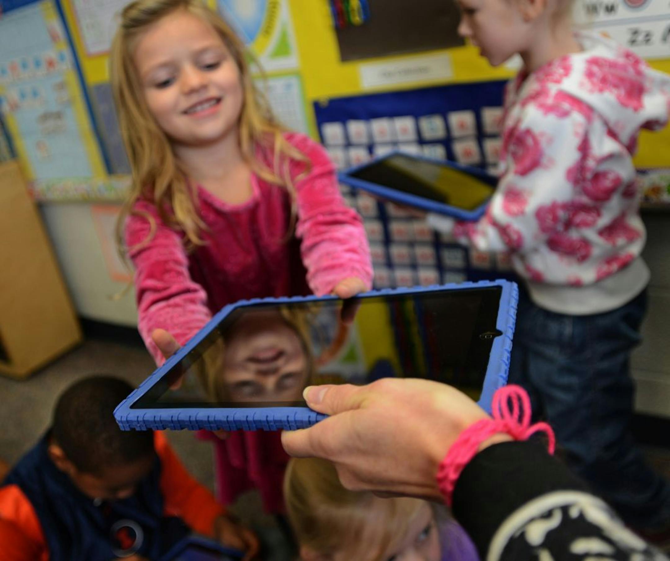 Kindergarten students at Royal Oaks Elementary School in Woodbury have begun using iPads in the classroom. Barbara Brown, a district spokeswoman, said there's no disputing that the children love to use them. The children were using ABC Spelling Magic which is an app that teaches the sounds of letters and how to build words. Elise McCabe reached for her Ipad. Each student has a unique user ID so they can progress at their own speed.
