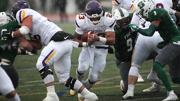Minnesota State Mankato running back Nate Gunn charged into the line Saturday, when he scored three touchdowns in the Mavericks' victory over Slippery