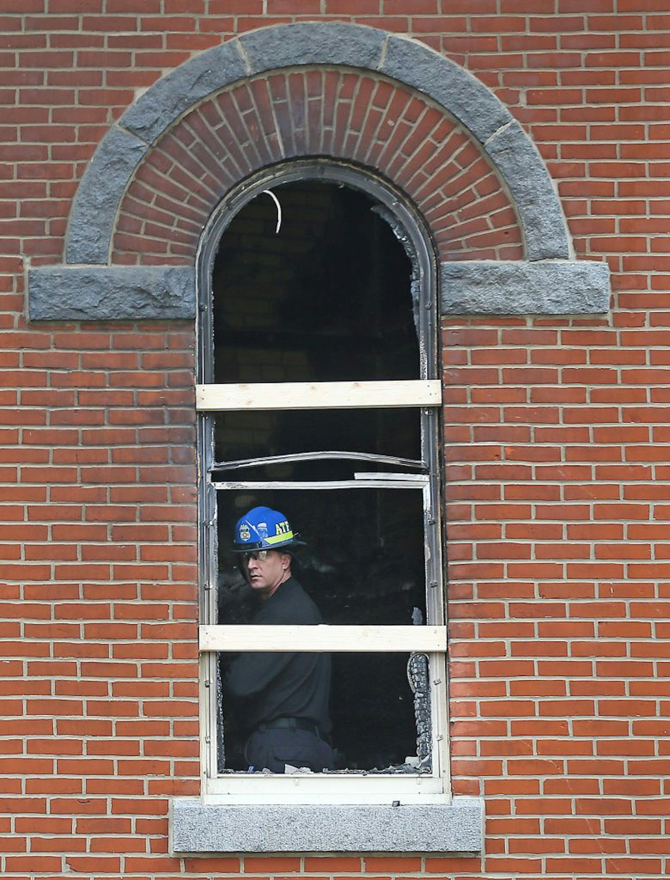 Local fire and federal agents arrived to inspect the scene where a fire damaged about 30 percent of the 120-year-old St. Mary's Catholic Church, Monday, March 14, 2016 in Melrose, MN.