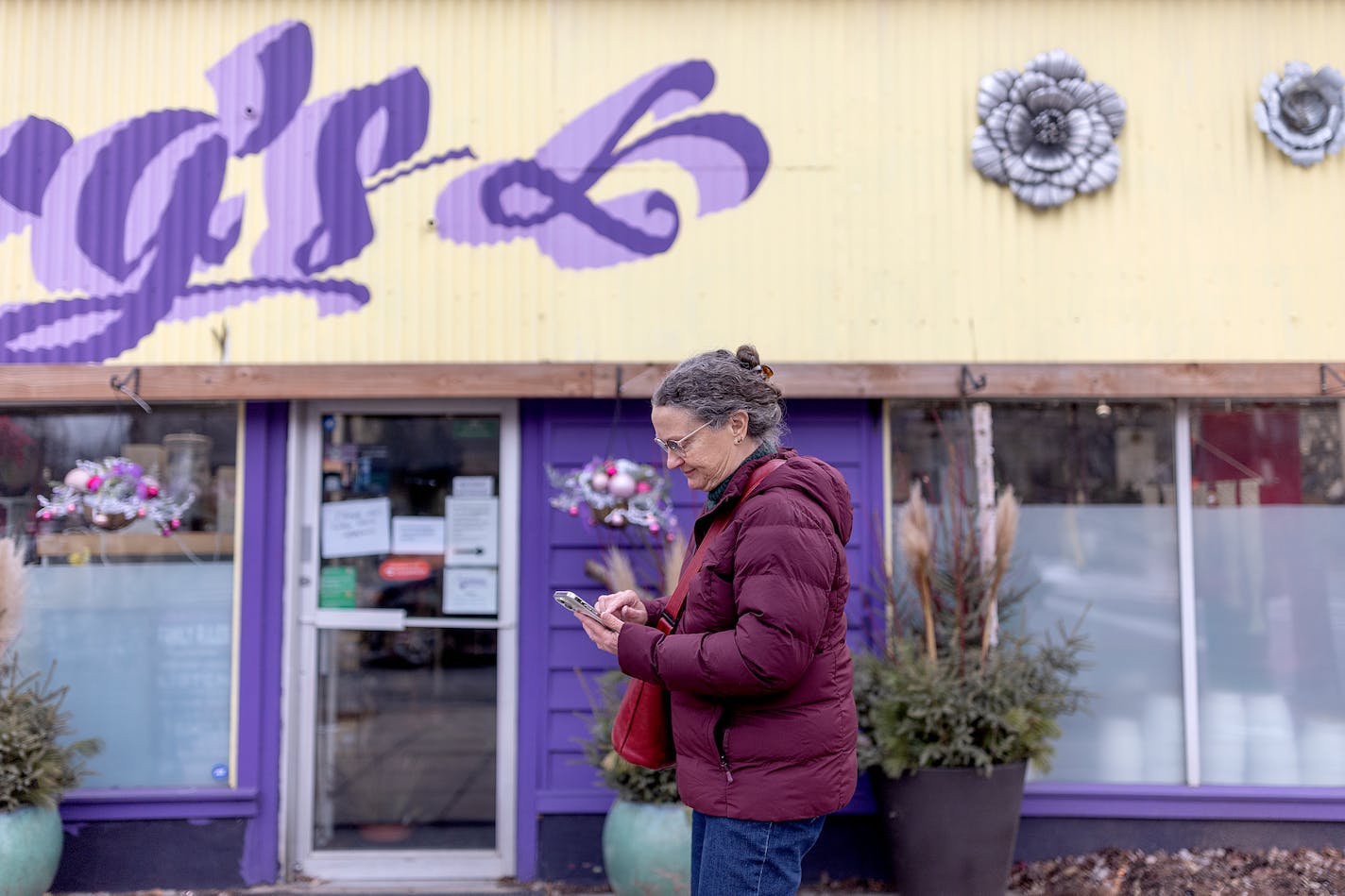 "I'm sad. This is a loss. I hate to have another Lake Street store go blank," said Mary Jones-Morris, a Longfellow resident for many years, as she attempts to research the closing outside Soderberg Floral and Gifts in Minneapolis, Minn., on Friday, Jan. 5, 2024. After 99 and a half years on Lake Street, Soderberg Floral and Gifts abruptly shut this week, ending a lynchpin for the Longfellow neighborhood. ] Elizabeth Flores • liz.flores@startribune.com