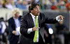 Mexico head coach Miguel Herrera yells during the first half of the CONCACAF Gold Cup championship soccer match against Jamaica, Sunday, July 26, 2015
