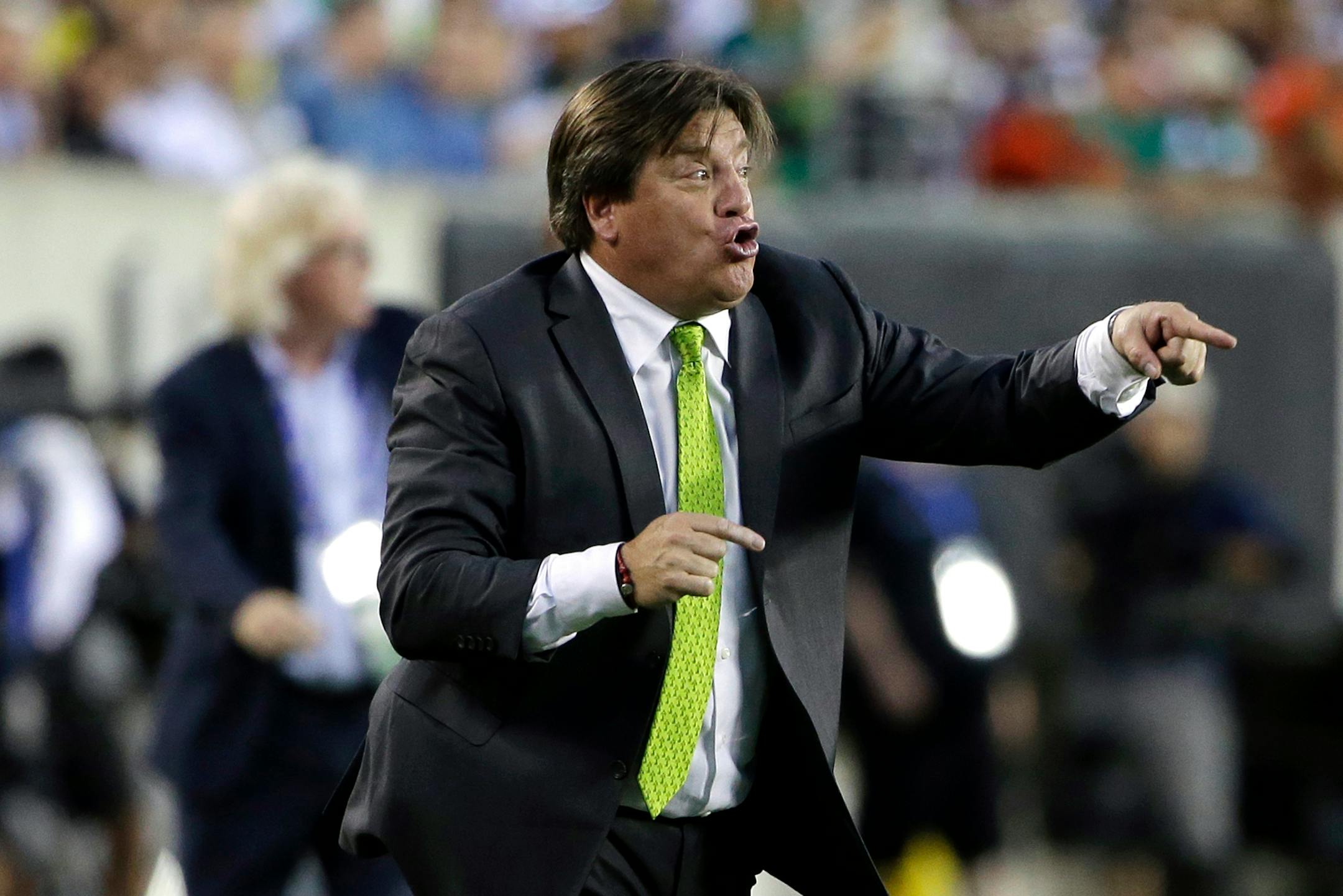 Mexico head coach Miguel Herrera yells during the first half of the CONCACAF Gold Cup championship soccer match against Jamaica, Sunday, July 26, 2015, in Philadelphia. (AP Photo/Matt Rourke)