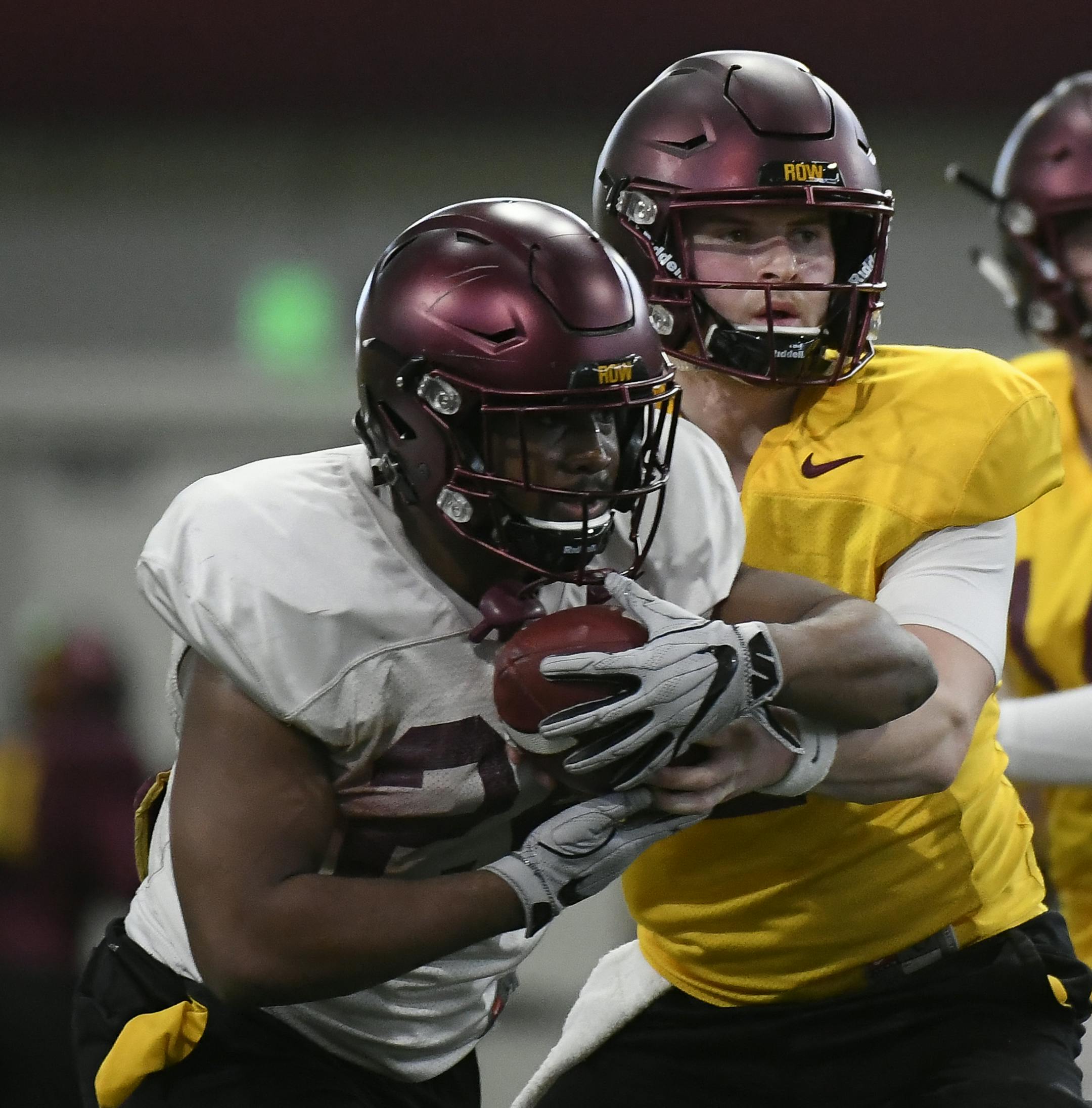 Minnesota Golden Gophers quarterback Tanner Morgan (2) handed off the ball to running back Mohamed Ibrahim (24) during Friday's open practice. ] Aaron Lavinsky &#xa5; aaron.lavinsky@startribune.com The University of Minnesota Golden Gophers football team held an open practice on Friday, March 15, 2019 at the Athletes Village's Football Indoor Practice Facility in Minneapolis, Minn.