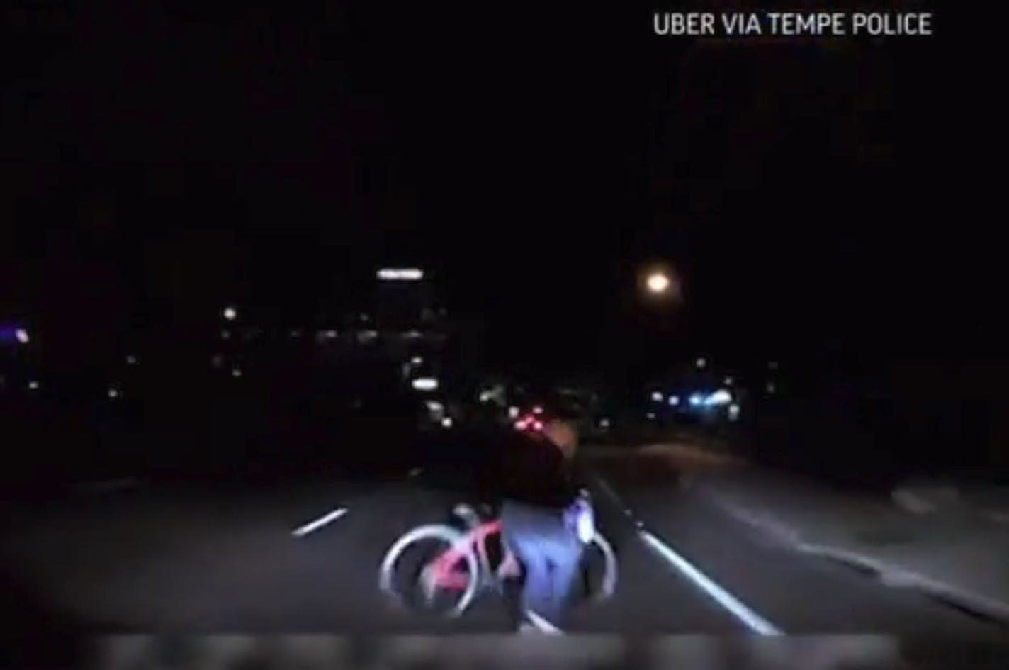 A pedestrian is seen emerging from the darkness before she is fatally struck by an Uber self-driving vehicle in Arizona, which recorded the incident.