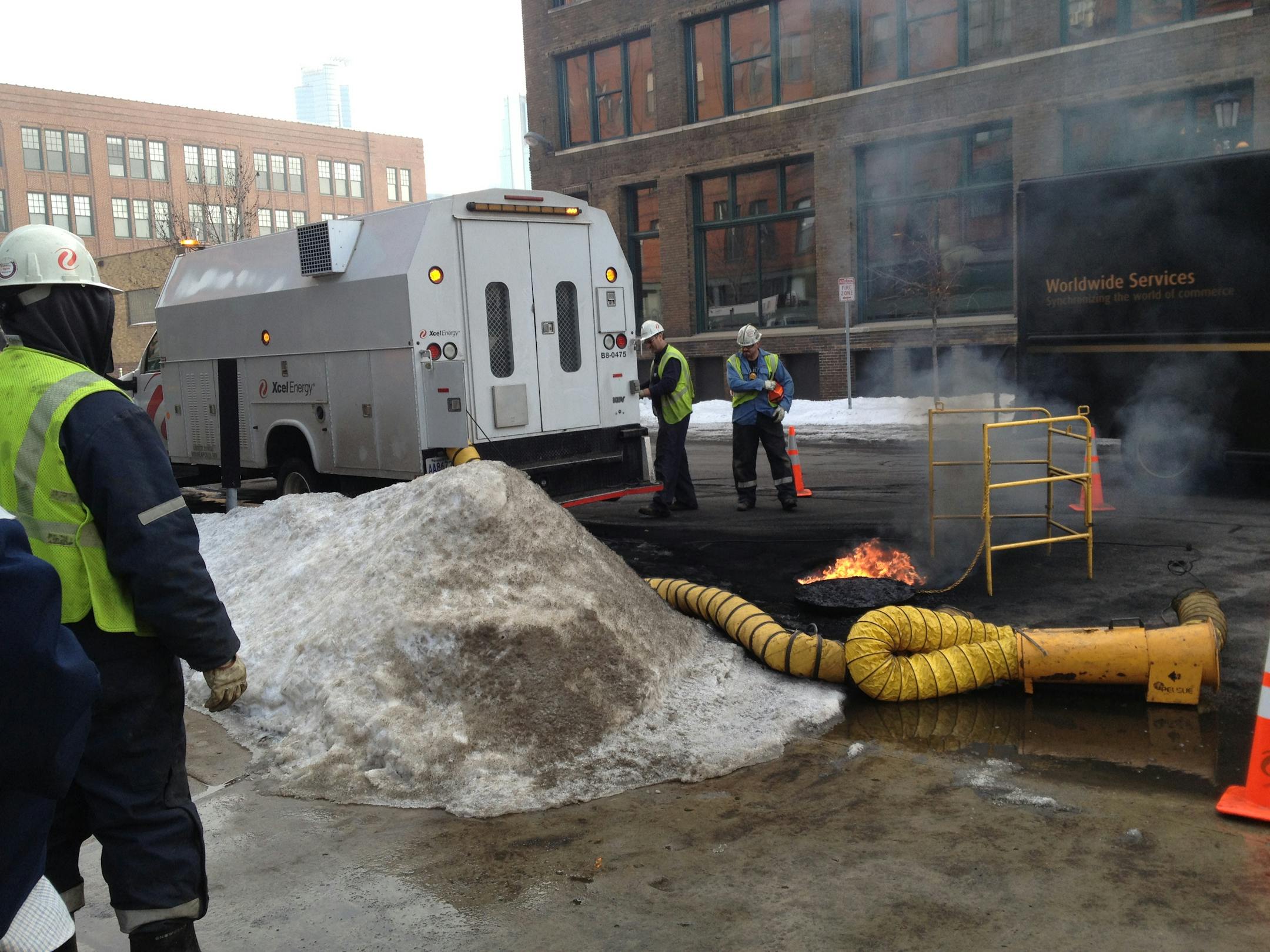 Flames shoot out of a manhole near 210 Second St. N.