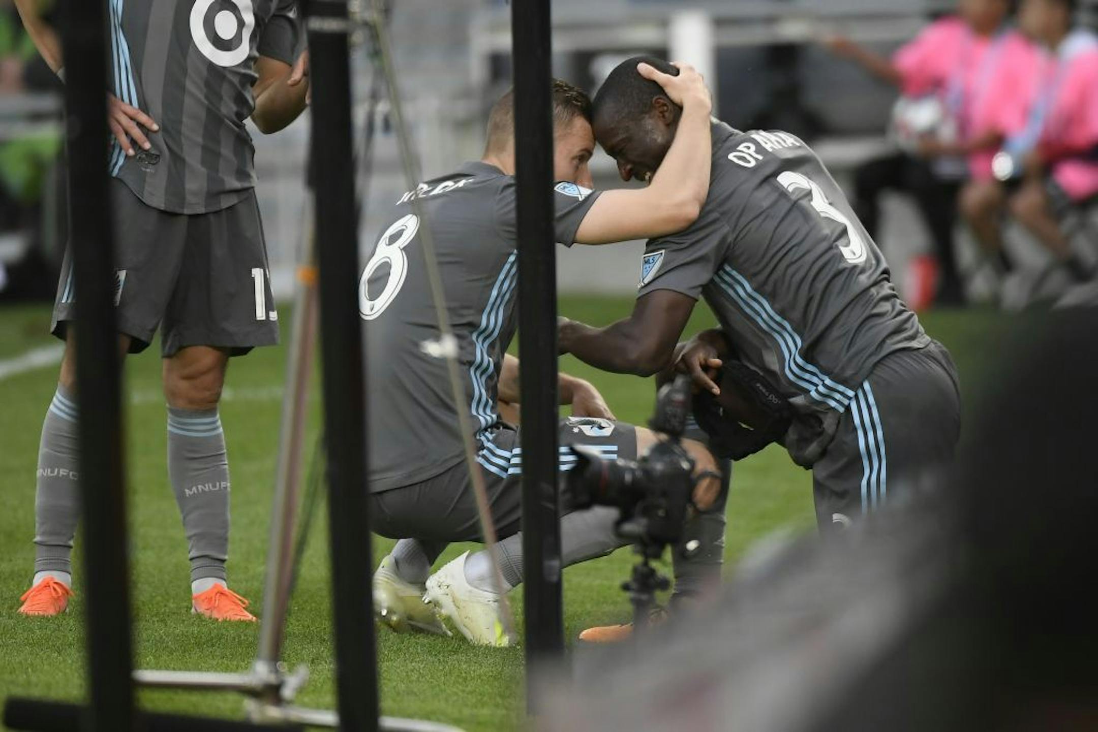 Minnesota United midfielder Jan Gregus (8) celebrated with defender Ike Opara (3) after Opara's goal in the first half.