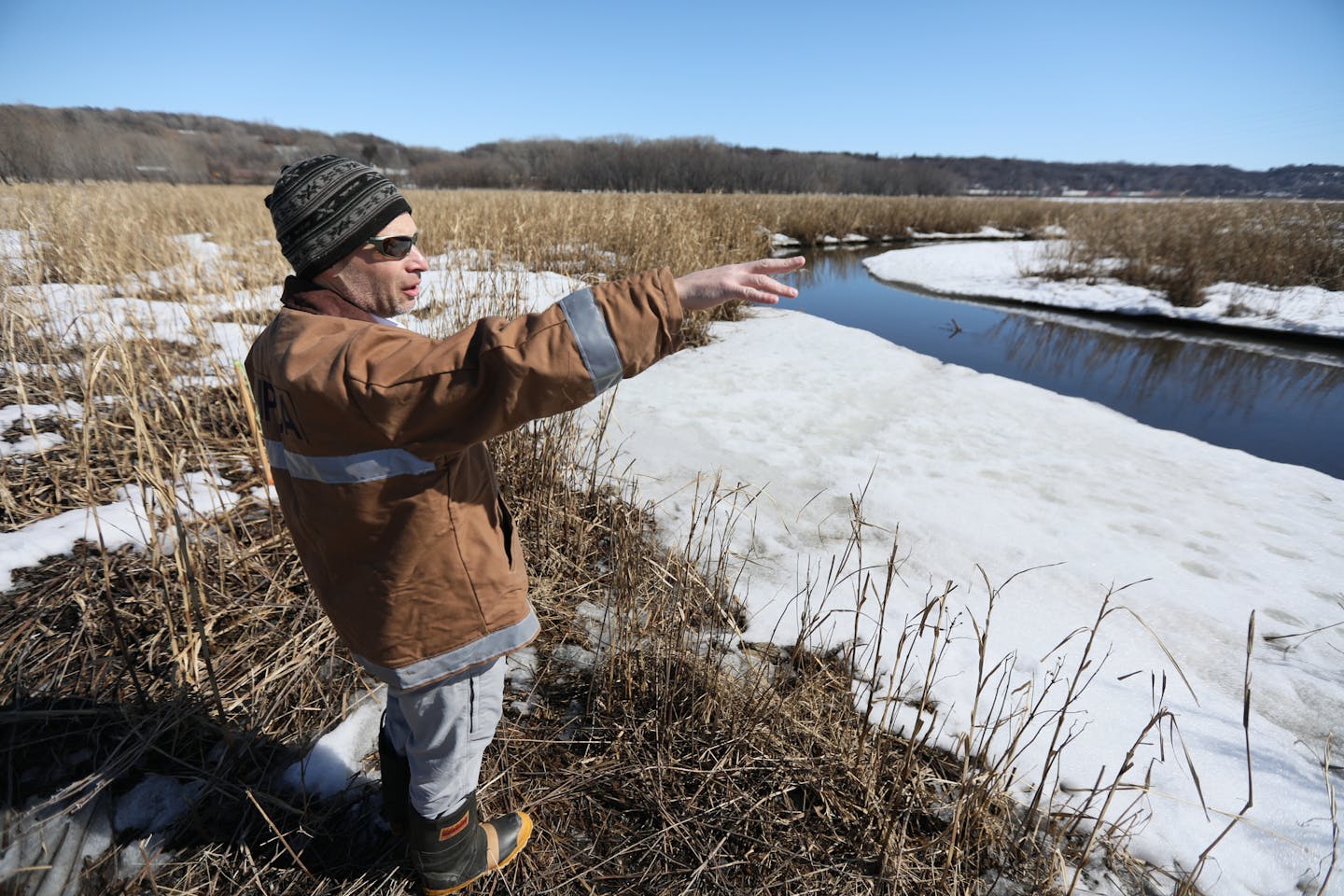 MPCA's lead Superfund official Hans Neve walks the former dump site where Barrels of toxic waste and leaking batteries once dotted the landscape around Pig's Eye Lake, which is the largest dump left from the days before regulated landfills. Cleaning up the Superfund site has been a slow process, but regulators are now leaning on the Met Council to address soils believed to be contaminated with metals from incinerated wastewater sludge. The Met Council is pushing back, saying it's not their respo