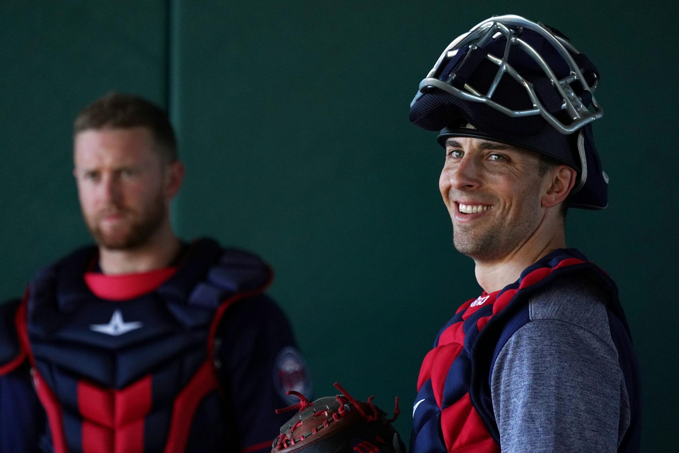 Twins catcher Jason Castro (15) watched as his fellow catchers practiced with pitching machines in the bullpen Thursday morning.