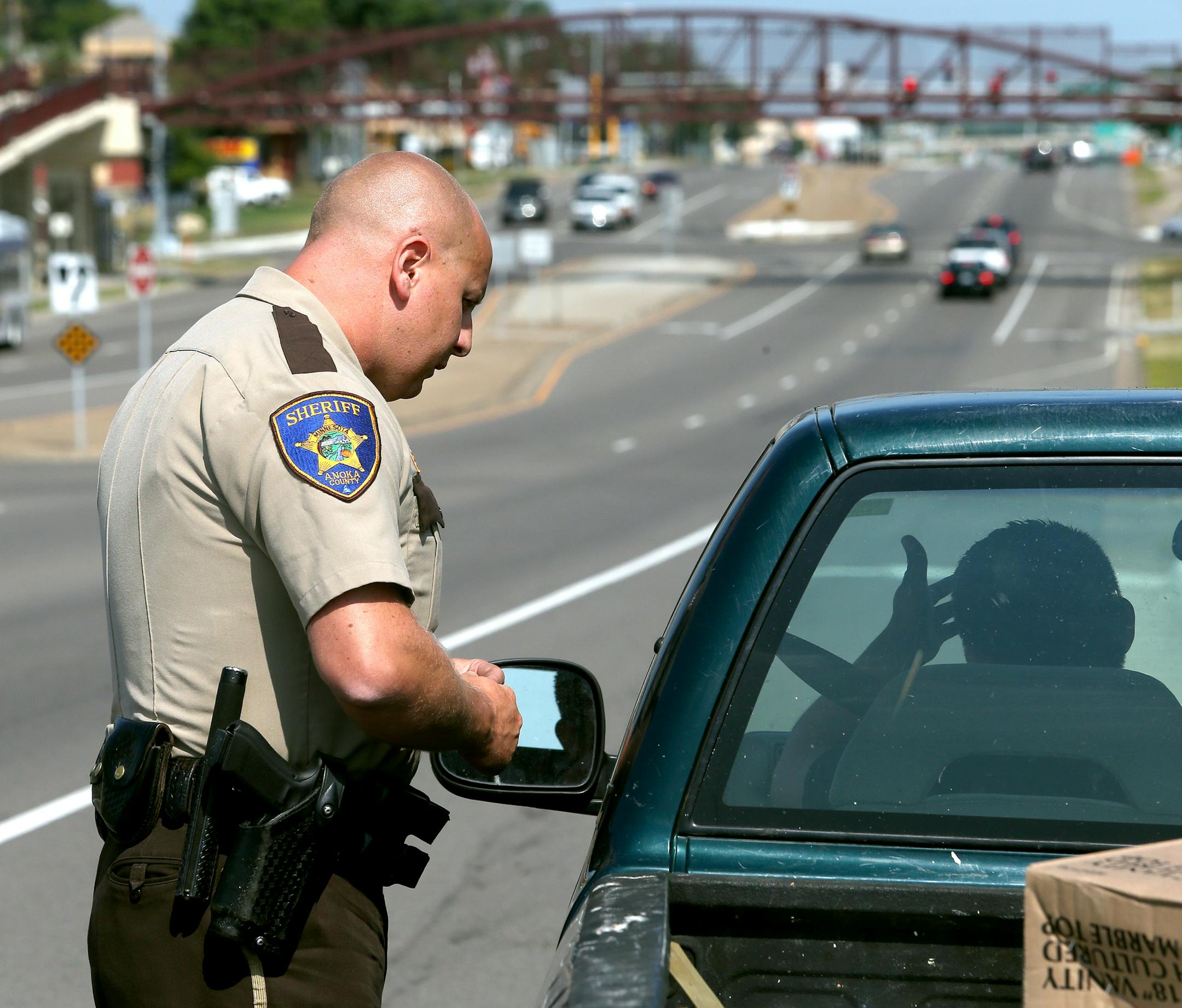 Anoka County Sheriff's Deputy Travis Bolles stopped a truck for an expired license on September 05, 2013 in Columbia Heights, MN. As he made the stop, Deputy Travis Bolles almost was run over by a car that ended up being pulled over by Columbia Heights Officer Jason Beckett. (not pictured) ] JOELKOYAMA‚Ä¢joel koyama@startribune The city of Columbus spends $247,000 a year for part-time police coverage. The city pays the Anoka County Sheriff's Office for one deputy 10 hours a day.